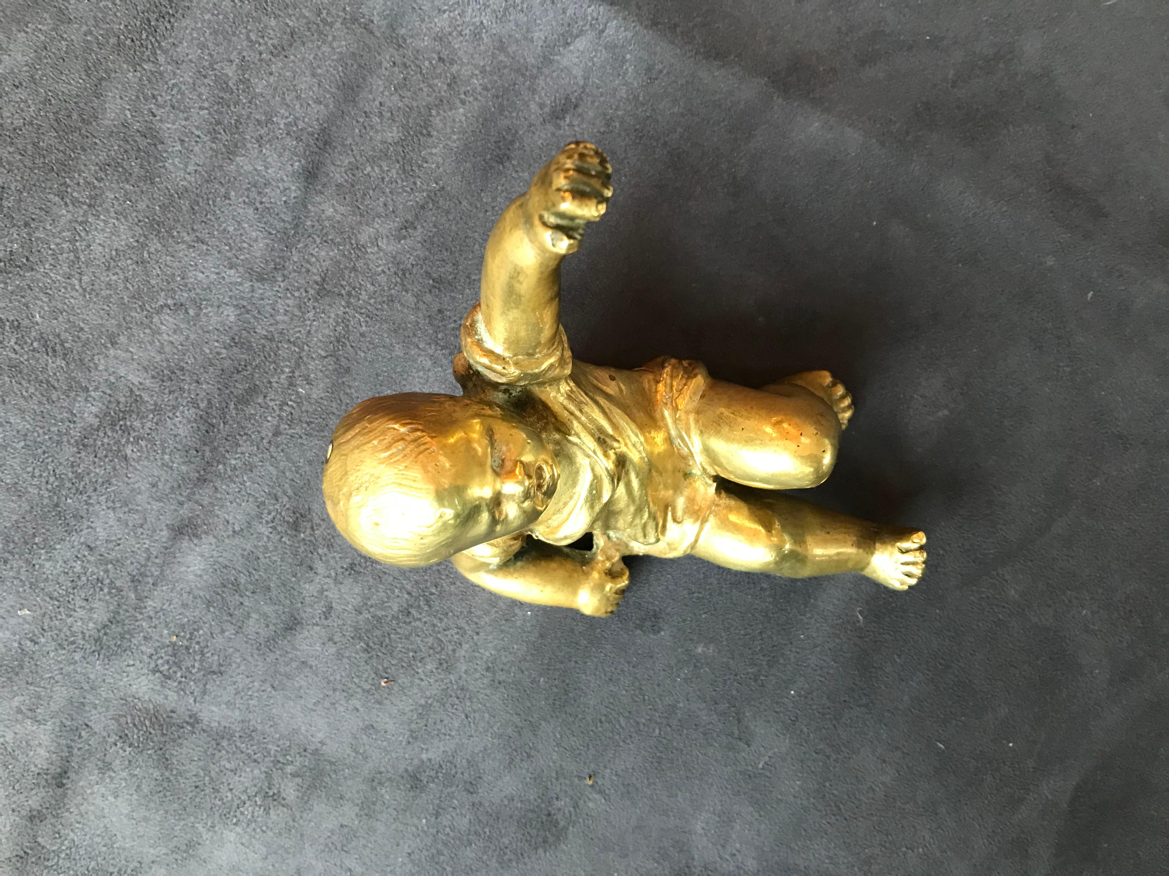 Baby gilt bronze paperweight sculpture.
In an excellent quality and condition.
France, 1950.