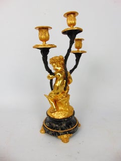 Gilt Bronze Candlestick Cast in the Form of a Ormolu Cherub