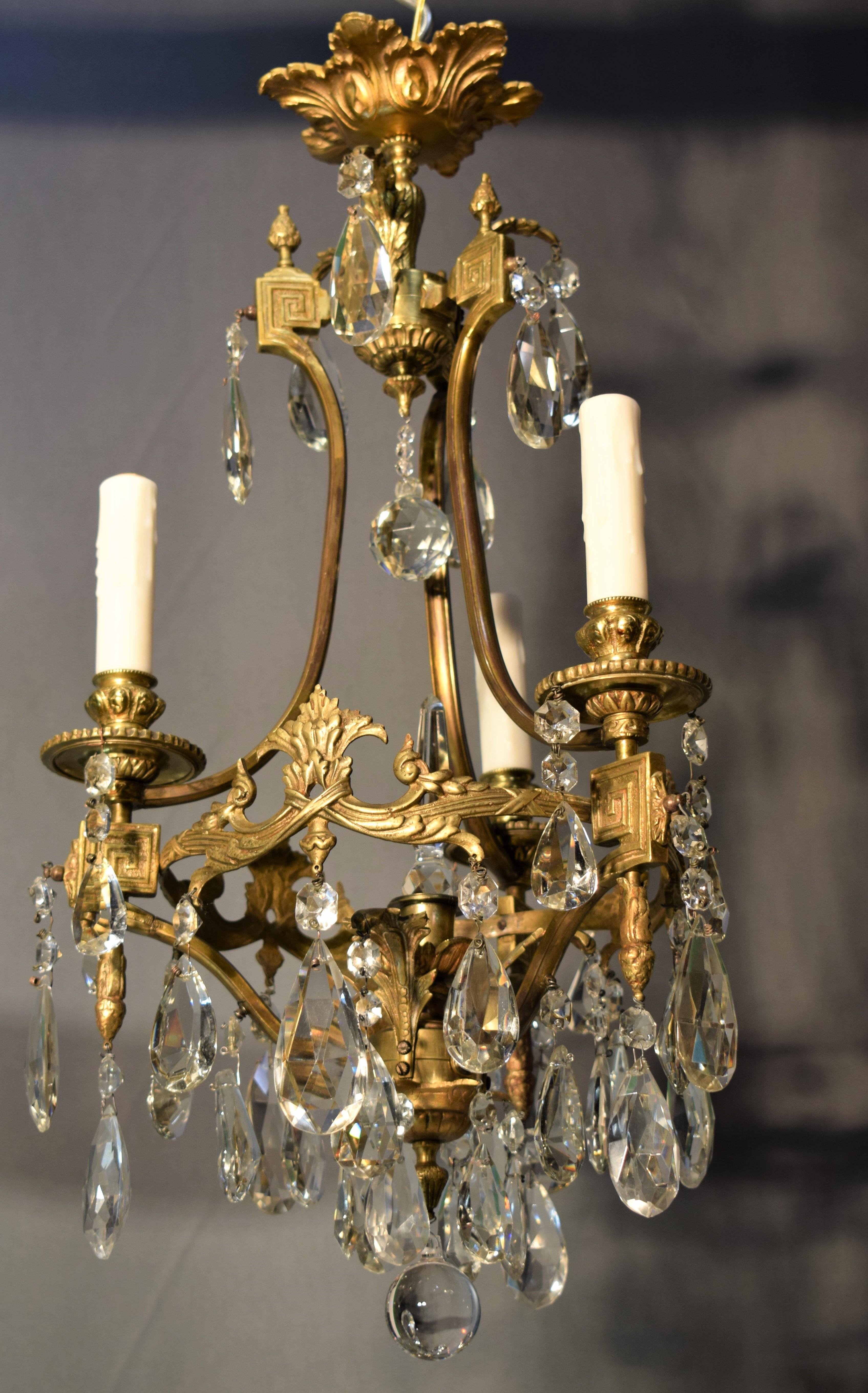 French A fine gilt bronze and crystal chandelier by Baccarat.