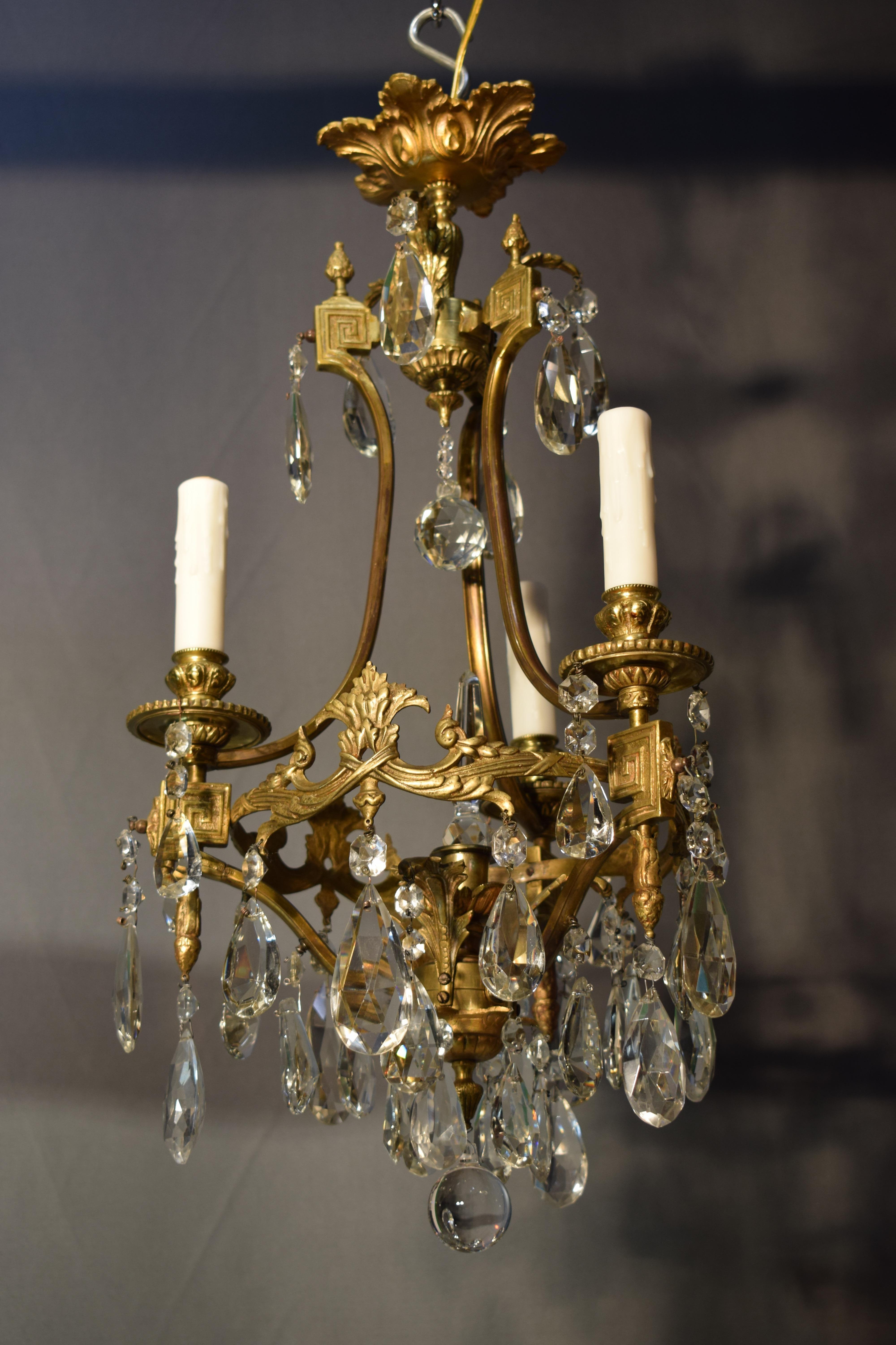 Early 20th Century A fine gilt bronze and crystal chandelier by Baccarat.