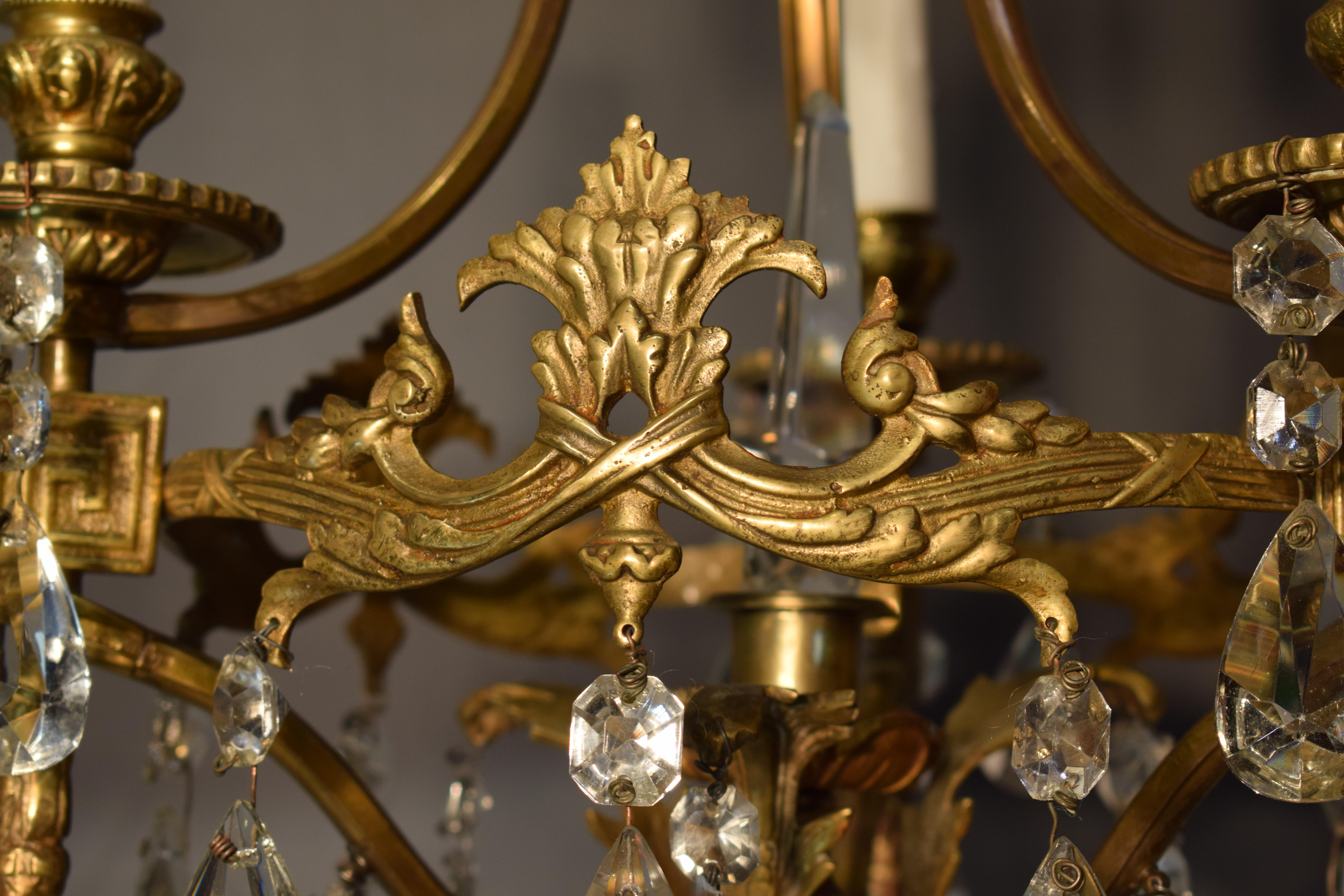 Bronze A fine gilt bronze and crystal chandelier by Baccarat.