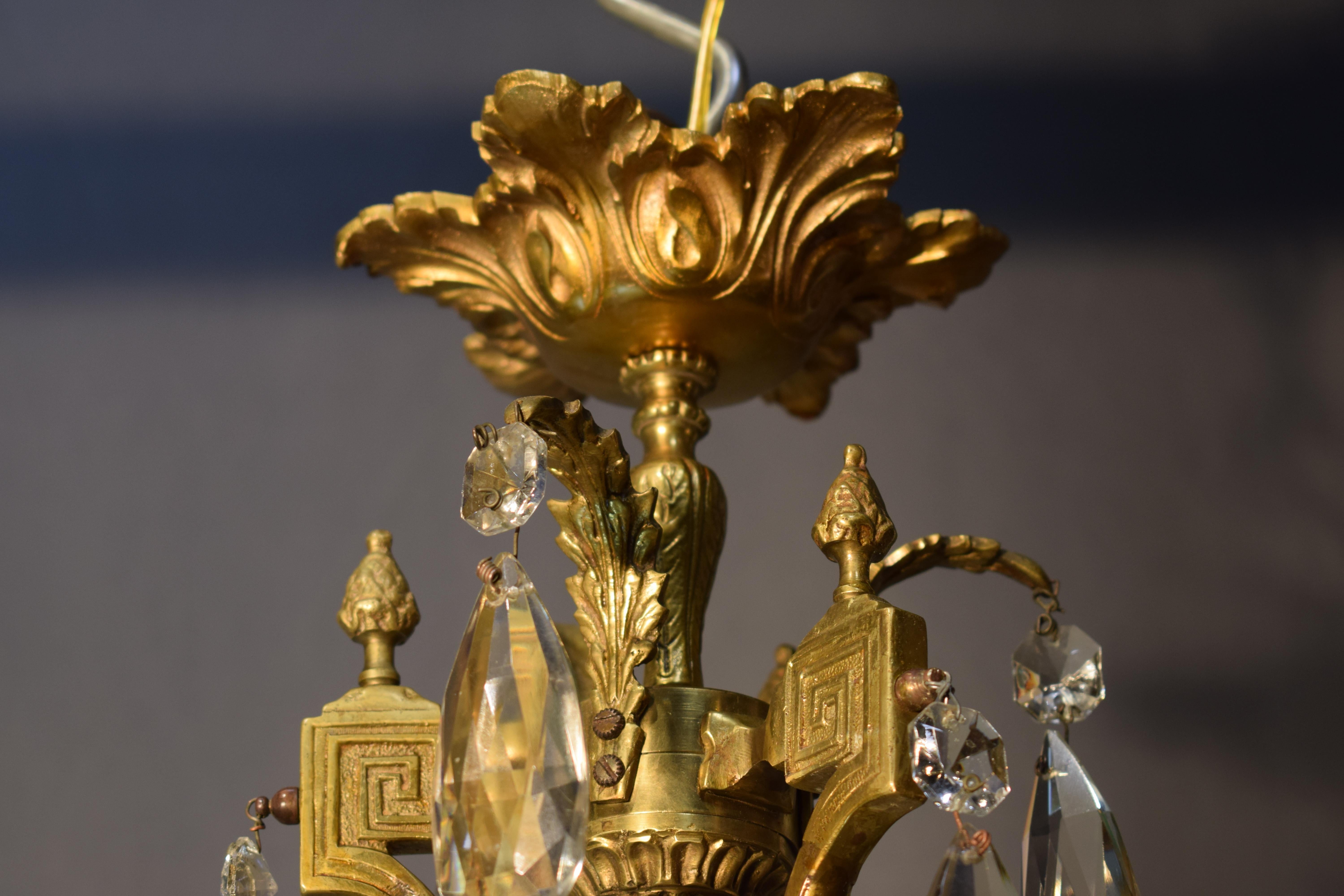 A fine gilt bronze and crystal chandelier by Baccarat. 1
