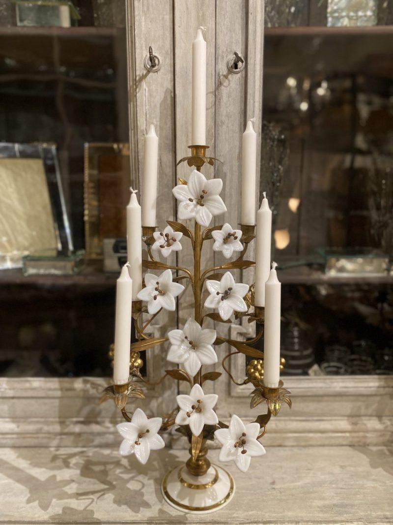 Stunning antique candelabra, beautifully decorated with 9 rare white opal glass lilies in various sizes, intermingled with brass vine leaves and grapes.Formed in gilded bronze and brass, with a rarely seen base, also in white opal glass.

This is a