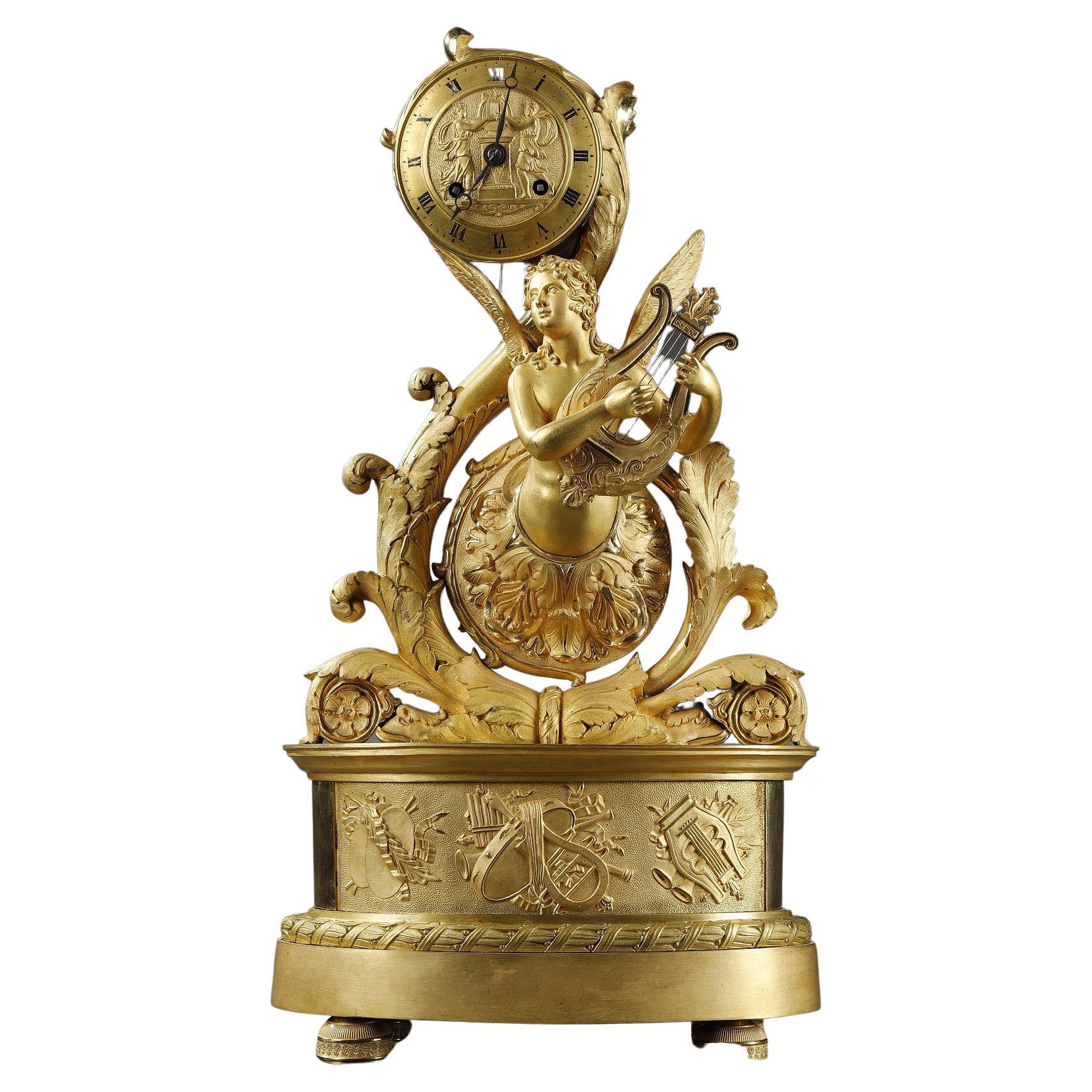 Gilt Bronze Clock with Winged Genie, Charles X Period For Sale