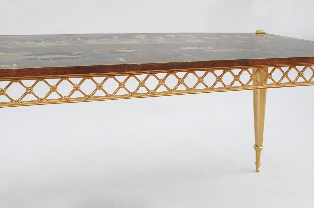 Rectangular coffee table with gilt bronze legs and wallpaper top. Standing on square section sheathed legs with bottom rings and adorned with stylized bellflowers motif on top, guilloche background. Openwork apron with a lattice ornament.
Chinese