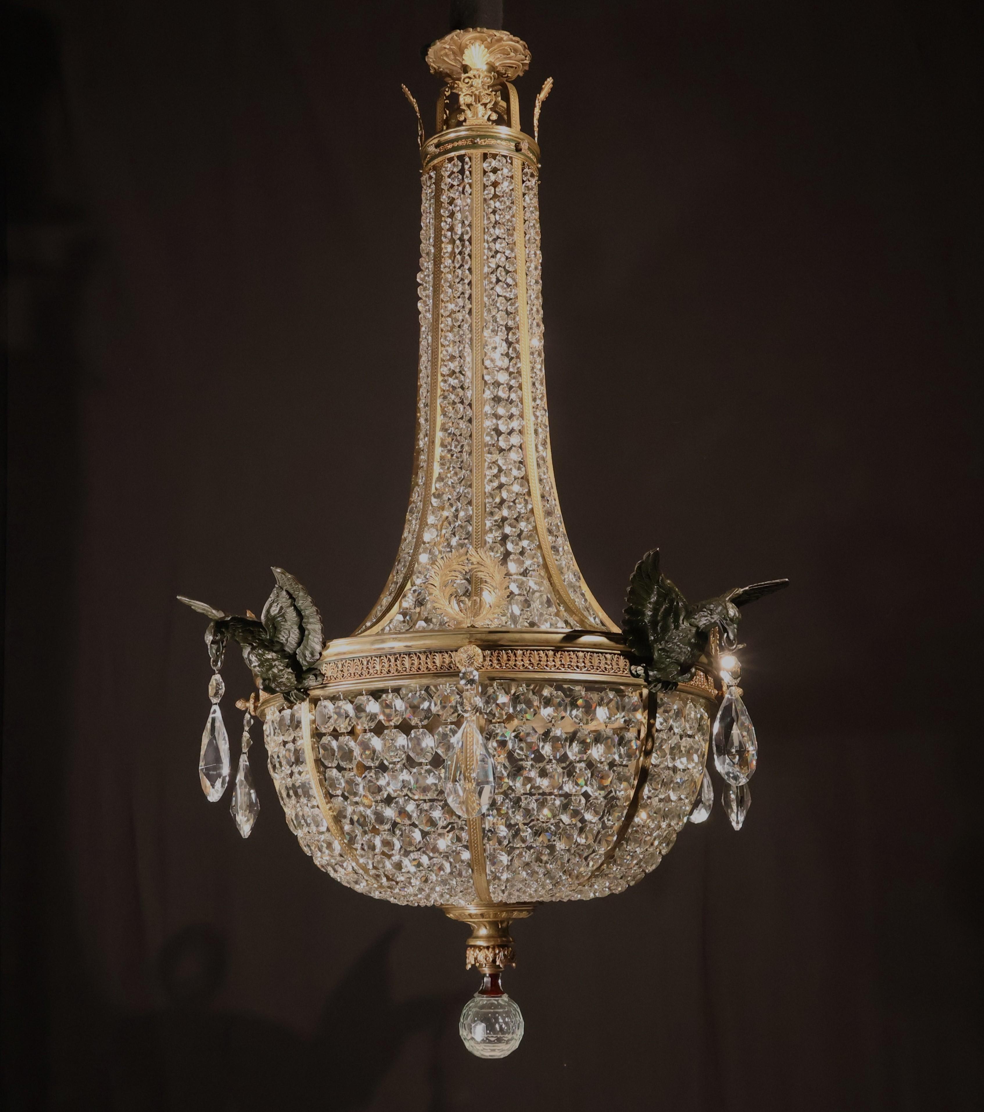 A Very Fine & Impressive Gilt Bronze & Crystal Basket Chandelier in the Empire style, featuring four patinated bronze eagle figures. 
France, circa 1900. 10 lights. 
Dimensions: Height 64