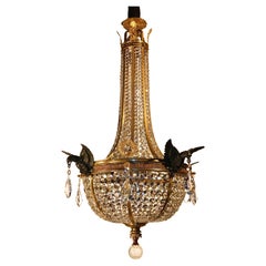 Araña de cesta de bronce dorado y cristal