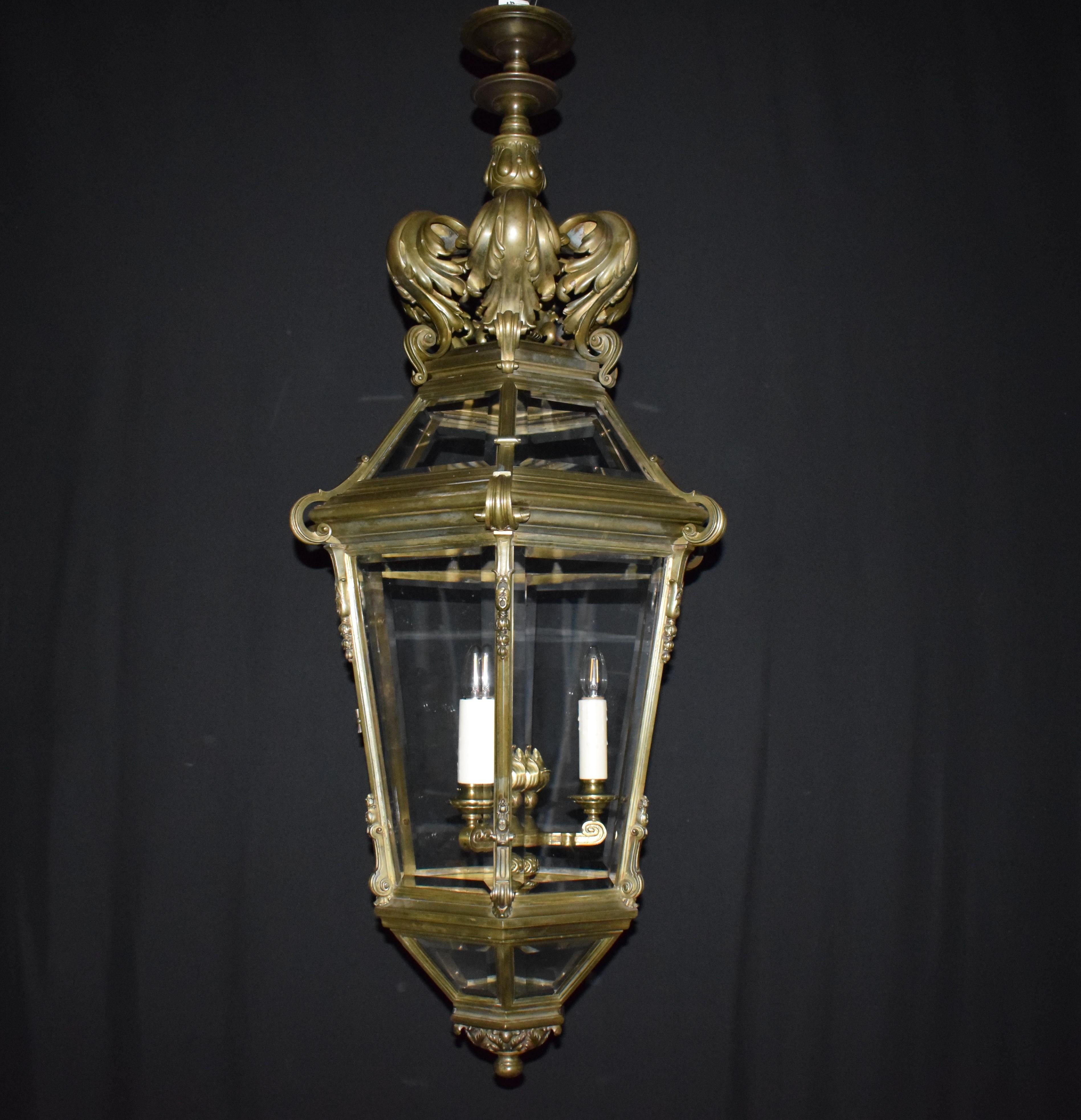An Exceptional Gilt Bronze Lantern featuring hand beveled glass panels in three rows. Imposing Size. 3 Lights. France, circa 1920.
Dimensions: Height 57
