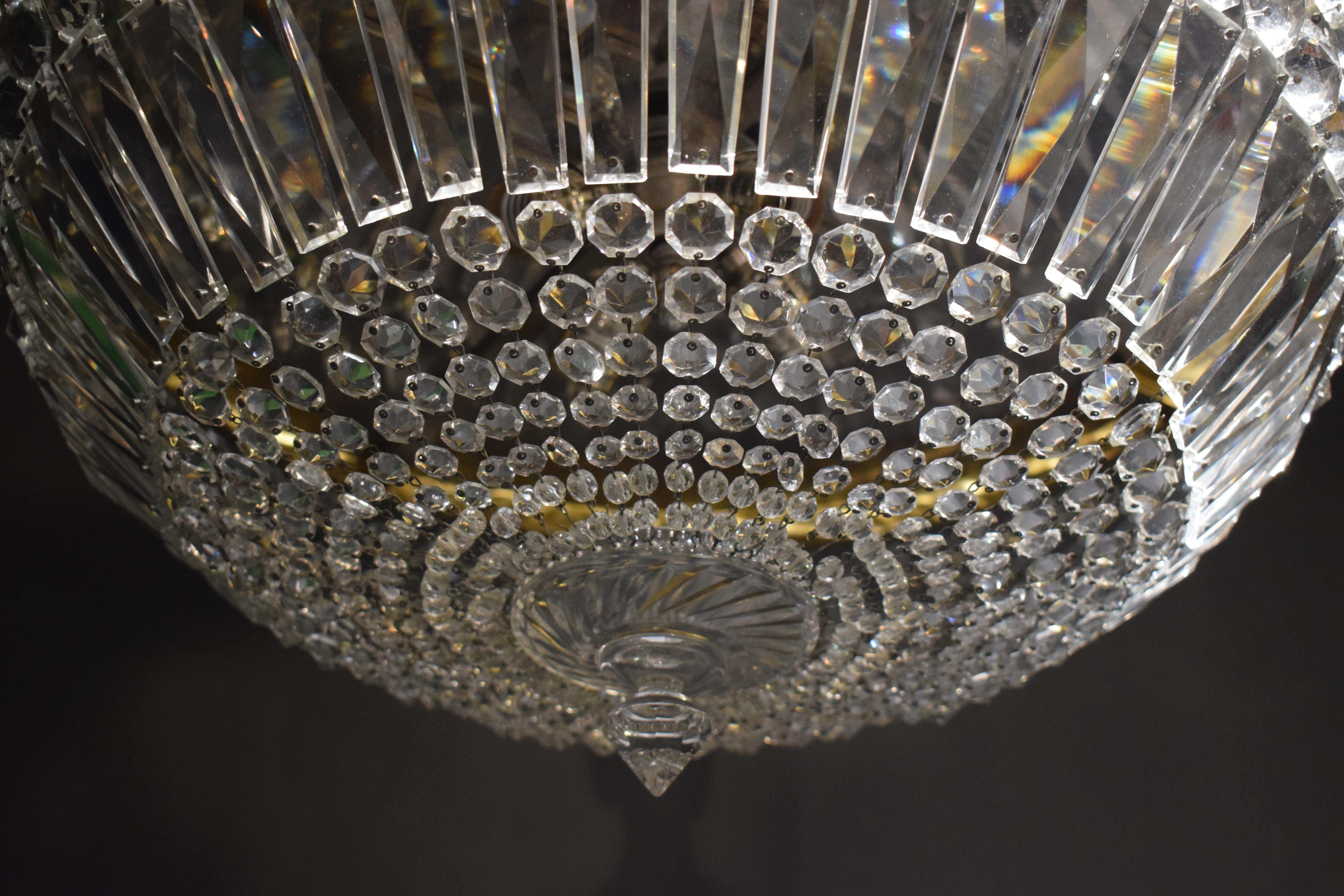 A very fine gilt bronze & crystal pendant. 4 lights. France, circa 1920.
Dimensions: Height 9