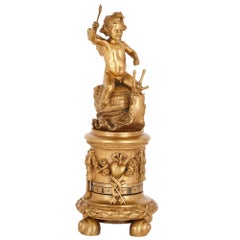 Gilt Bronze Cylindrical Mantel Clock with Emblems of Love