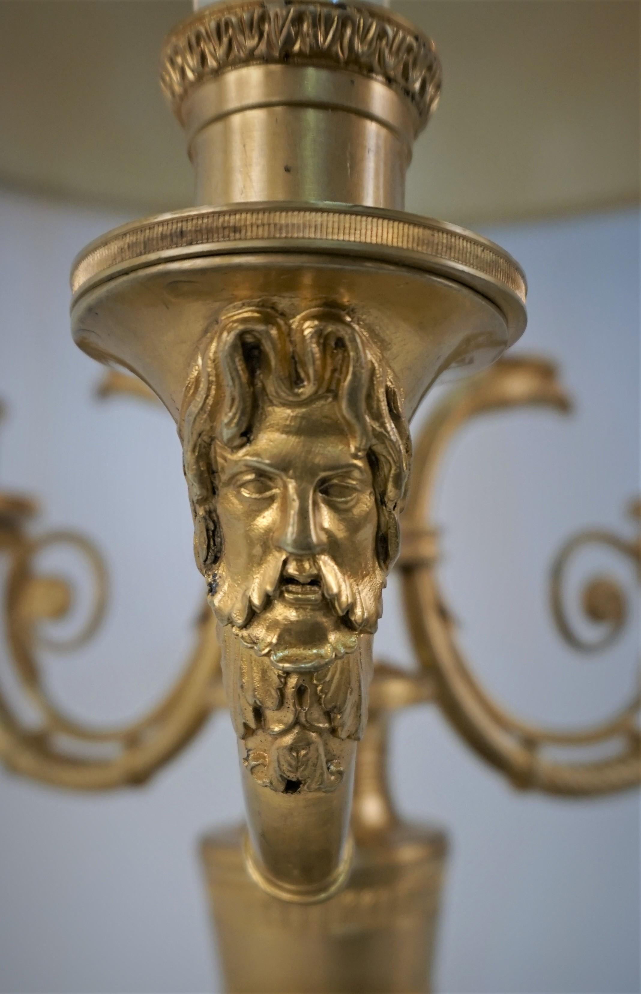 Empire gilt bronze three-light Bouillotte lamp, crafted in France in great detail casting.