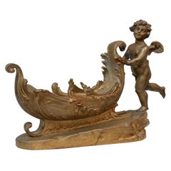 Gilt Bronze Figure of a Cherub Pushing a Sleigh, circa 1900