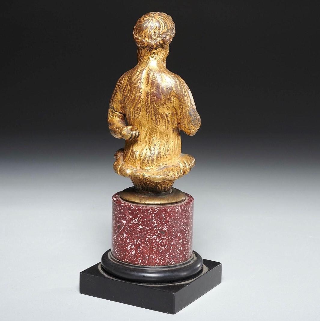 Baroque Gilt Bronze Figure of a Satyr on Porphyry and Black Marble Base   For Sale