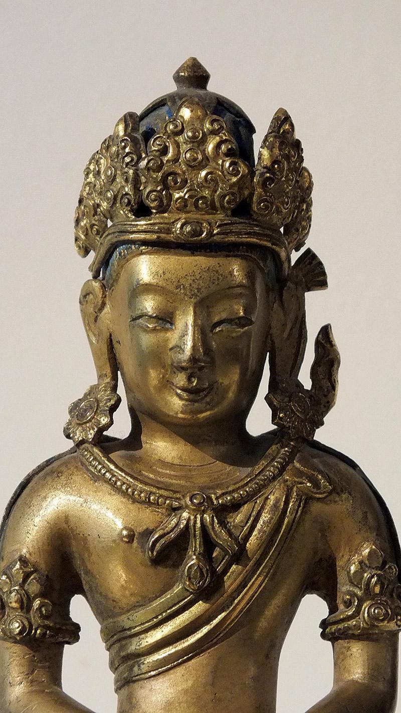 A gilt-bronze figure of Amitayus, Qianlong period, dated 1770 A.D.

Incised Qianlong mark cyclically dated to gengyin year (corresponding to 1770 A.D.) and of the period.

The basis with the text: 