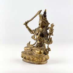 Gilt Bronze Figure of Manjusri Seated on a Lotus Base