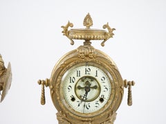 Reloj de chimenea con pie de bronce dorado y base de mármol que representa a un guerrero de Cartago