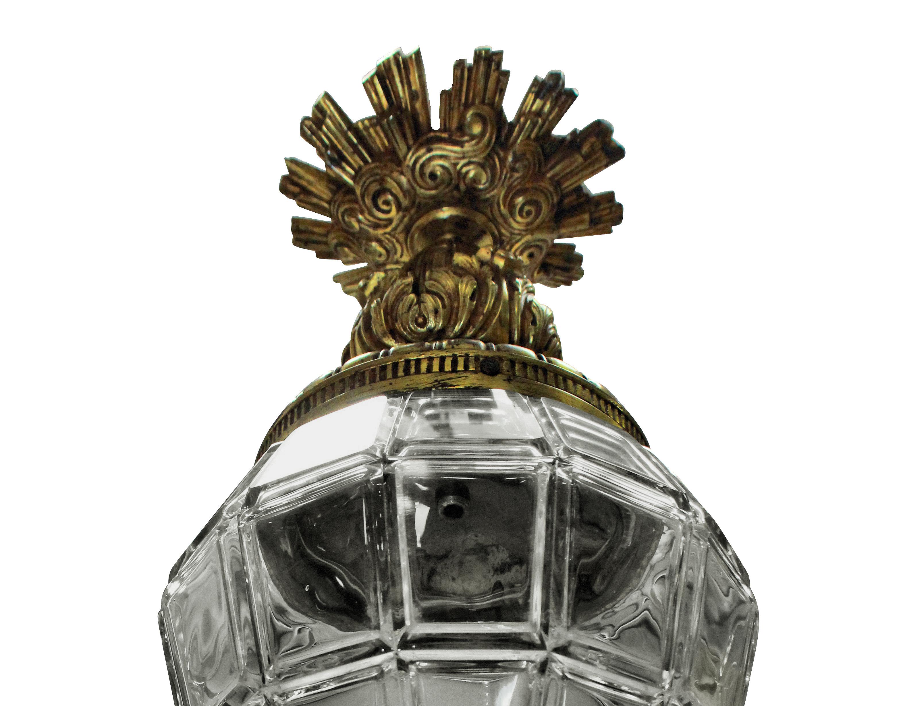 A French gilt bronze and moulded glass lantern, modelled on the lanterns at Versaille, the canopy having sun rays.