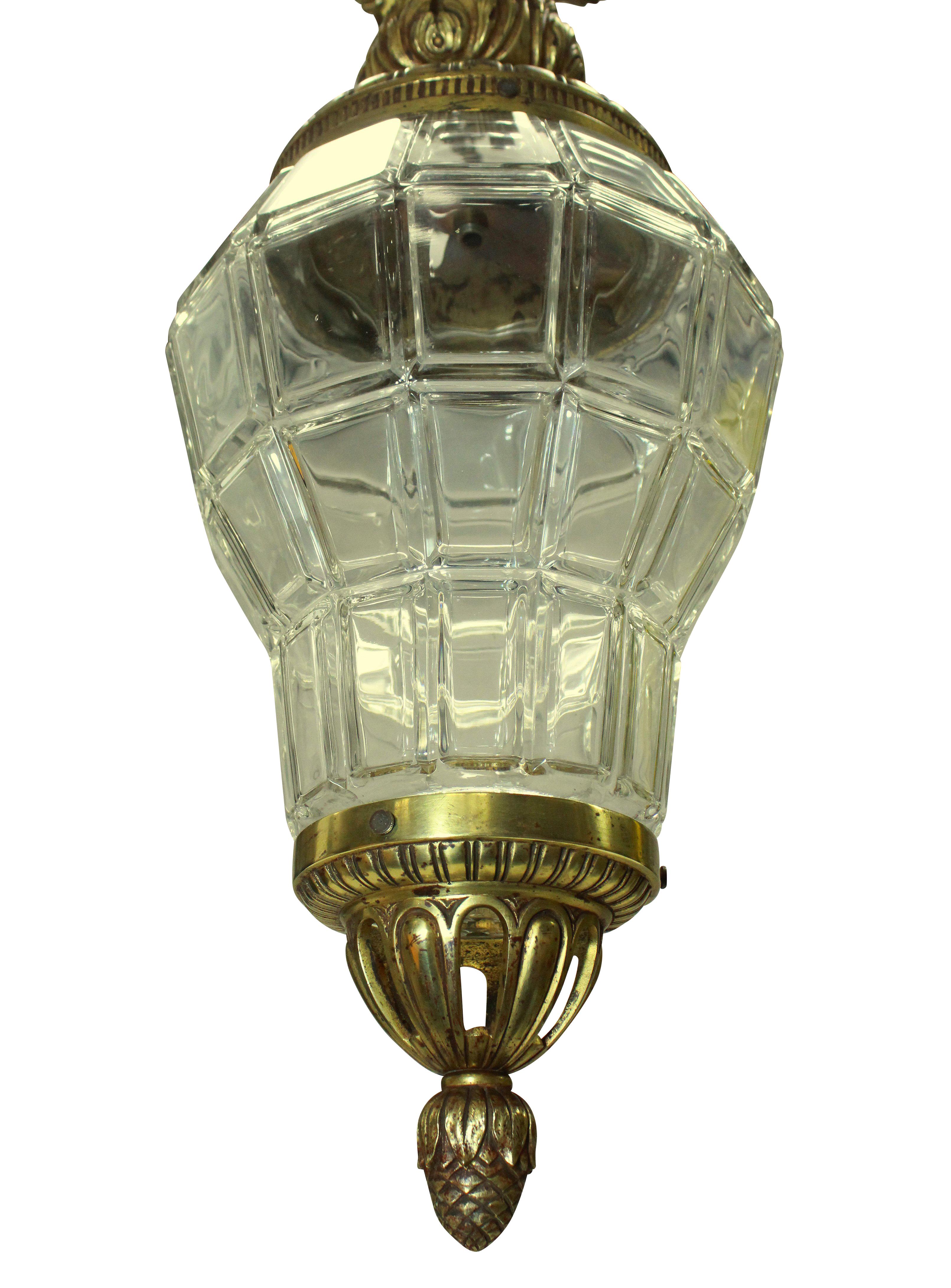 A French gilt bronze and glass lantern, modelled on the lanterns at Versaille, the canopy having sun rays.