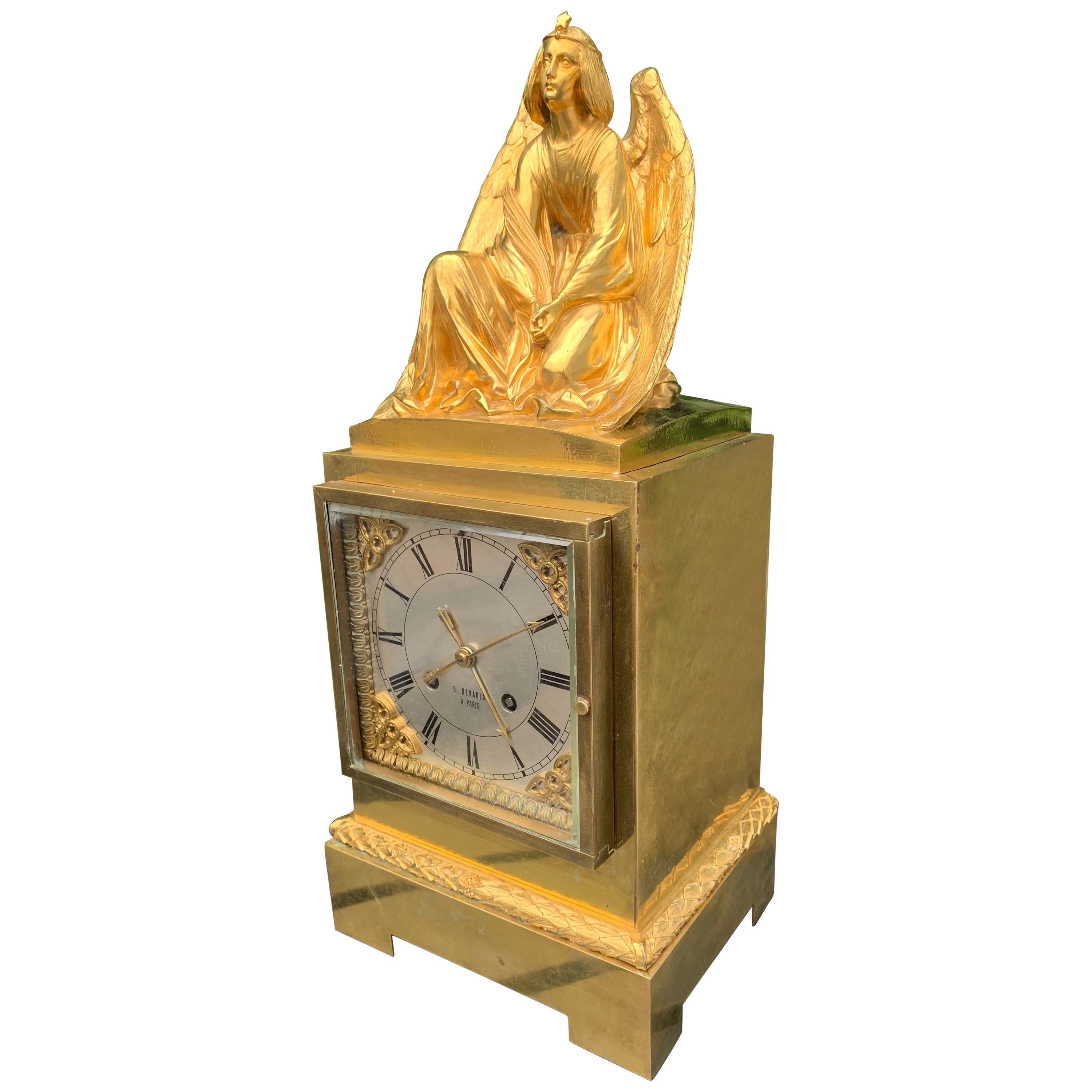 Rare and wonderful antique clock from the early 1800s.  Marked: S. Devaulx, Paris.

Having an impressive, stylish and sizable antique clock like this gracing your mantel piece or side table will instantly change the look and feel of the room she is