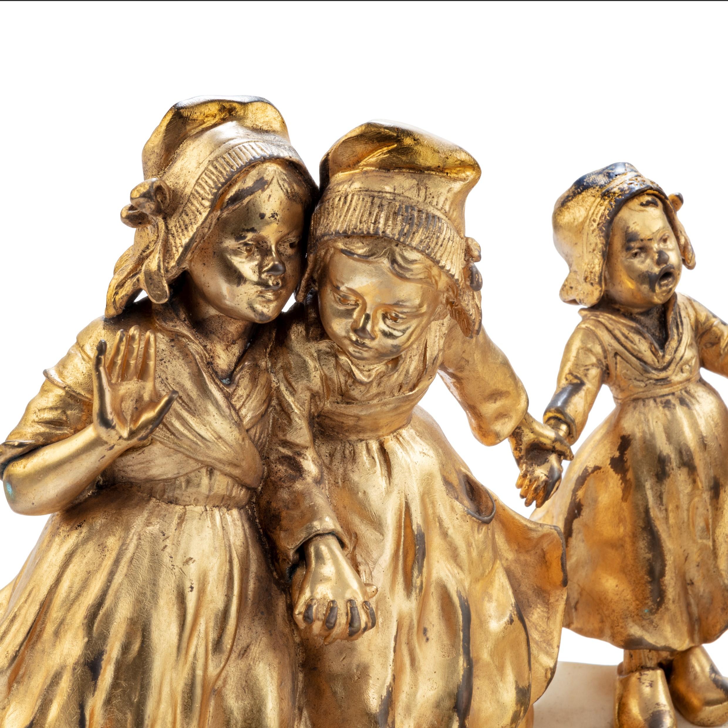 A charming gilt bronze group of Dutch children by Guiseppe or Joseph D’Aste In Good Condition For Sale In Lymington, Hampshire