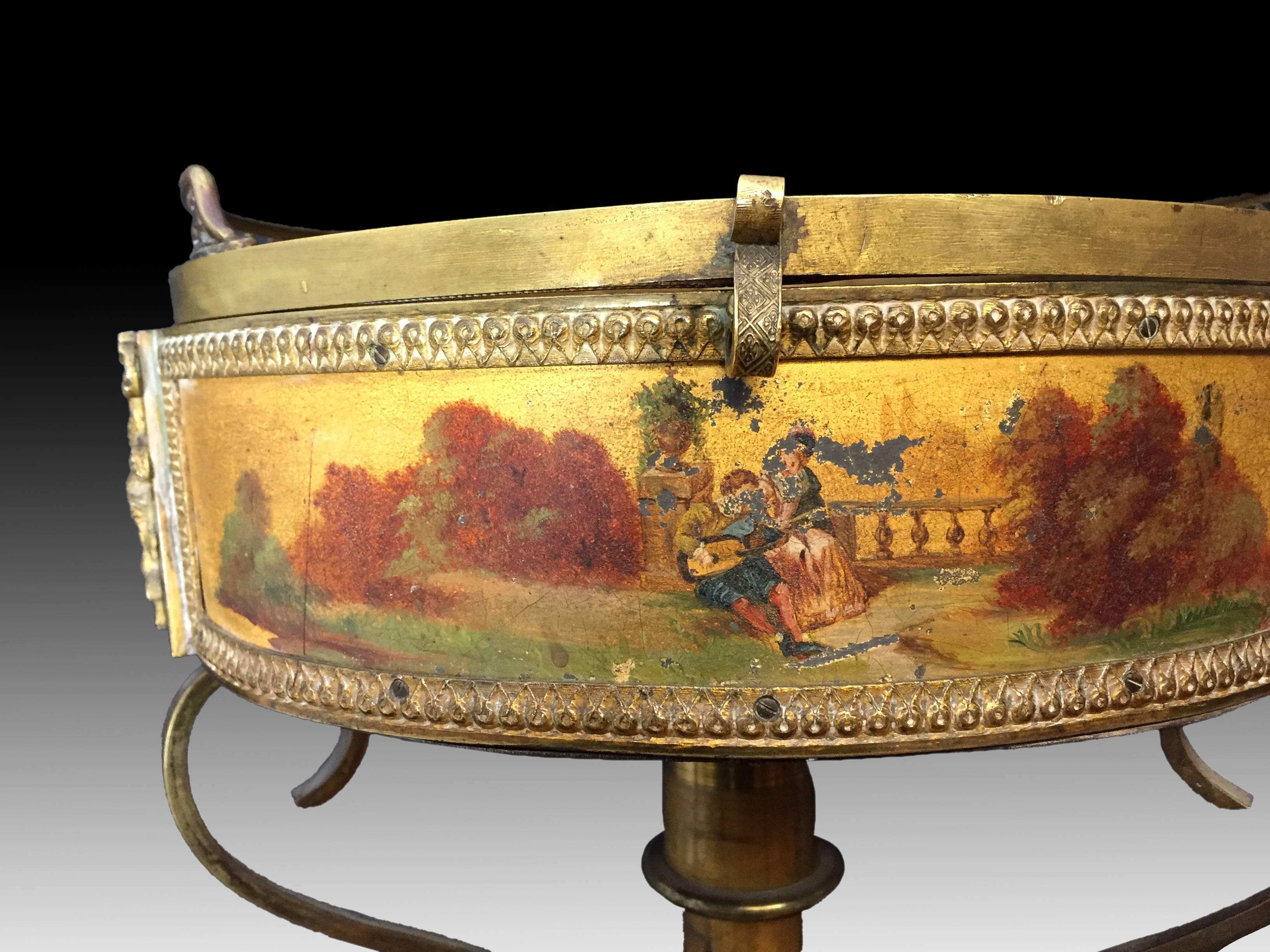 Gueridon showcase in polychromed and gilded bronze, France, Napoleon III, about the third third of the 19th century. The small circular table shows a top panel in transparent glass, which shows the interior upholstered, and the waist decorated with