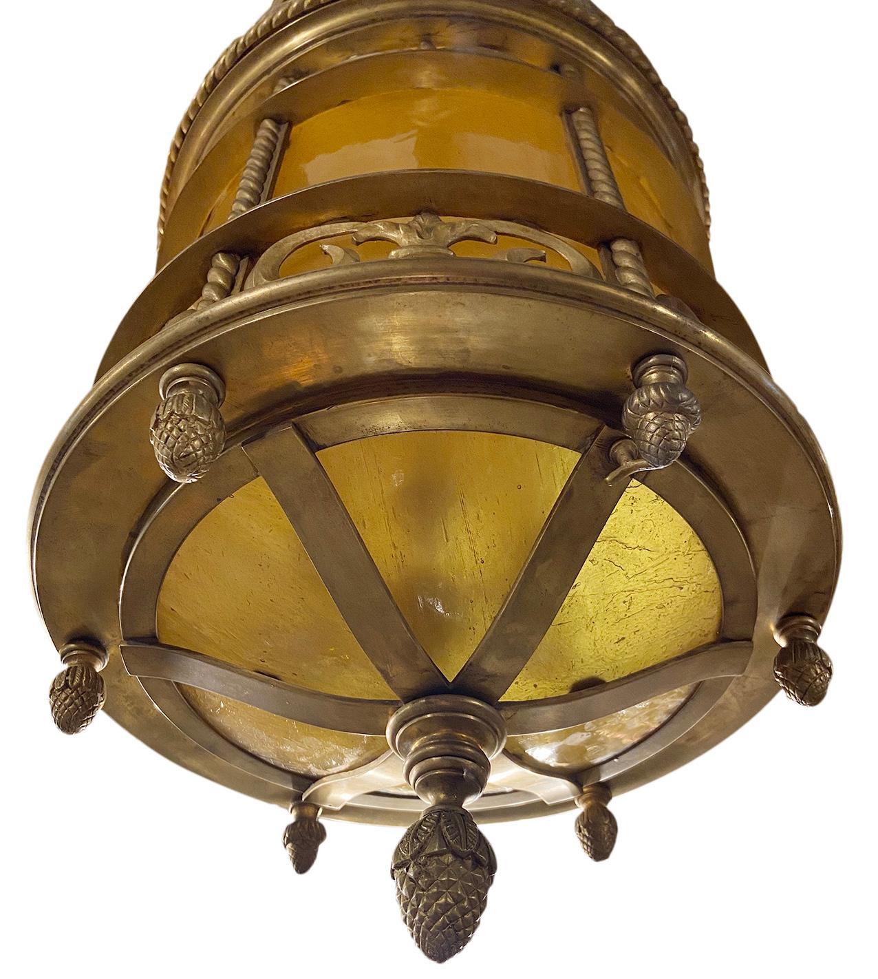 A circa 1920s American gilt bronze lantern with amber leaded glass, original finish and patina.

Measurements:
Height 33.5