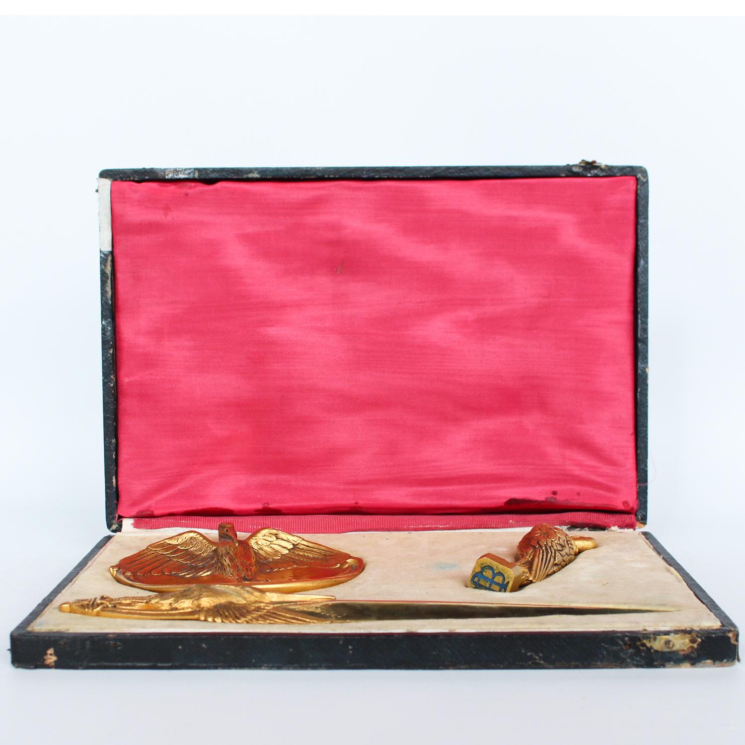 A gilt bronze letter set with stork motif, comprising of letter opener, tray and seal. In original fitted presentation case. Signed 