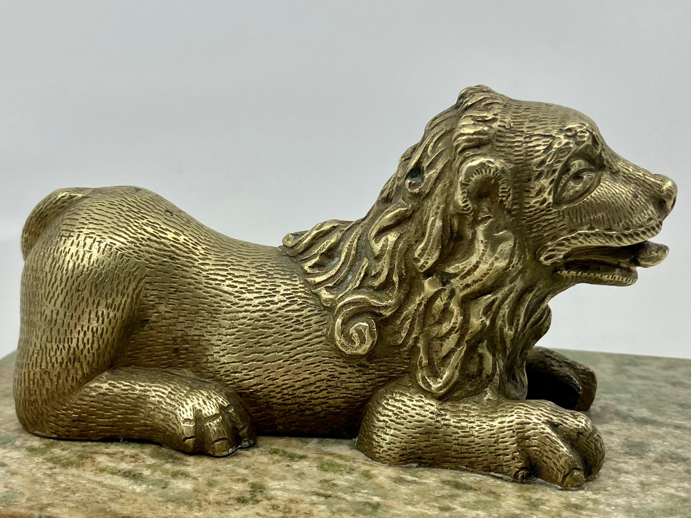 Gilt bronze lion on marble base. Antique chased gilt bronze recumbent lion on rare green speckled marble base.  Italy, late 17th century. 
Dimensions: Overal 5.88