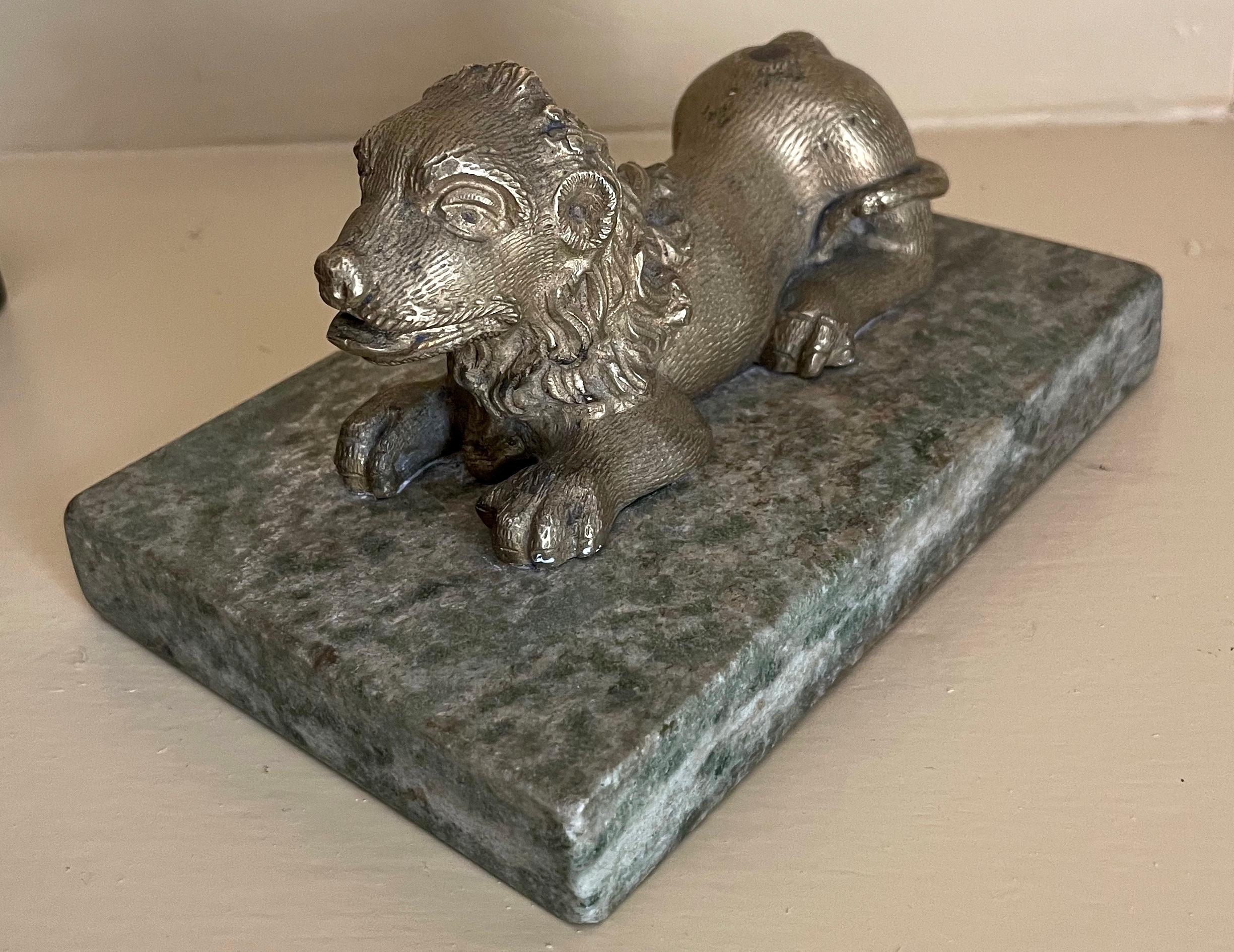 Gilt bronze lion on marble base. Antique chased gilt bronze recumbent lion on rare green speckled marble base.  Italy, late 17th century. 
Dimensions: Overal 5.88