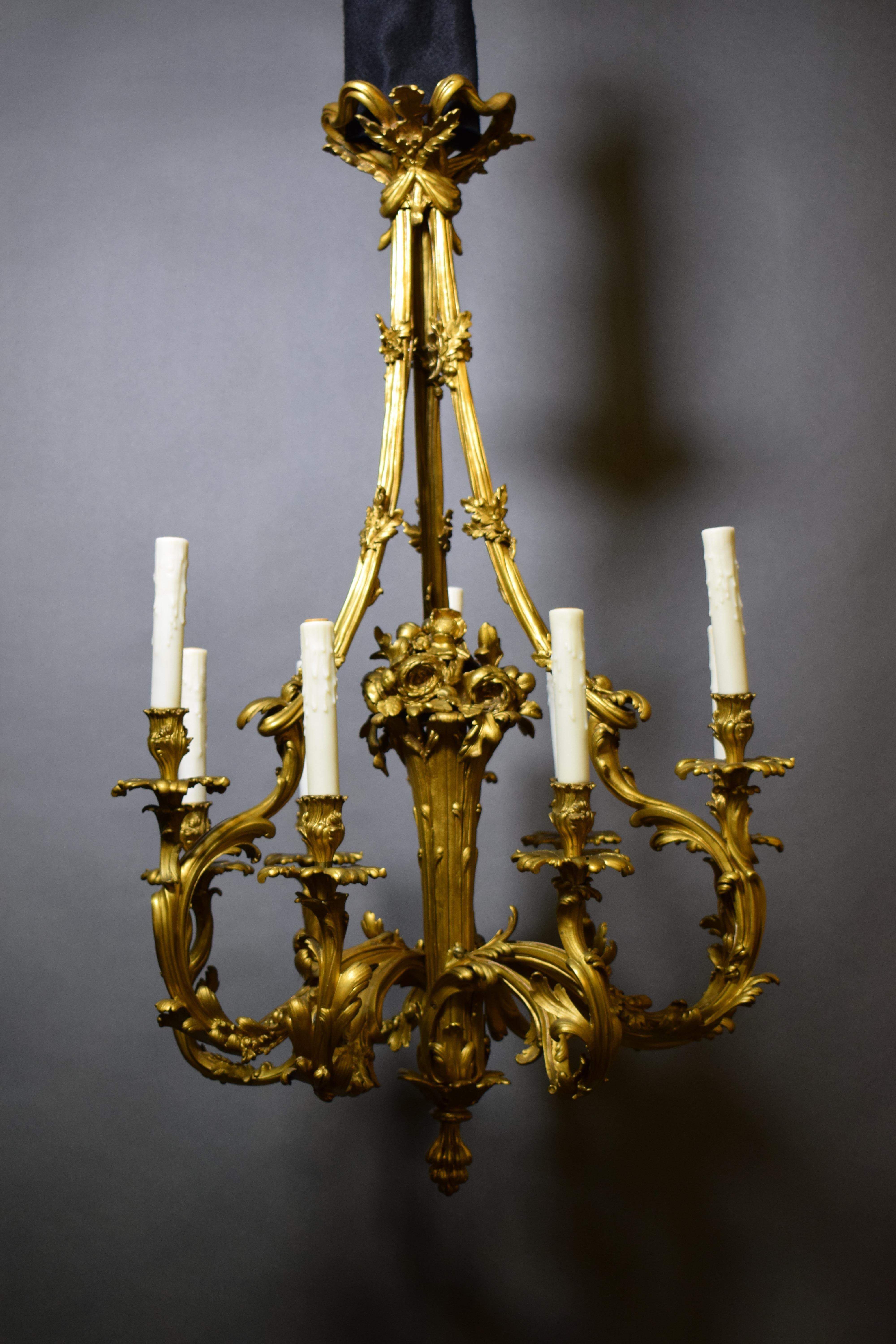 Gilt Bronze Louis XV style Chandelier. Centered by stylized flower basket. 9 Lights. France, circa 1900.
CW5185
