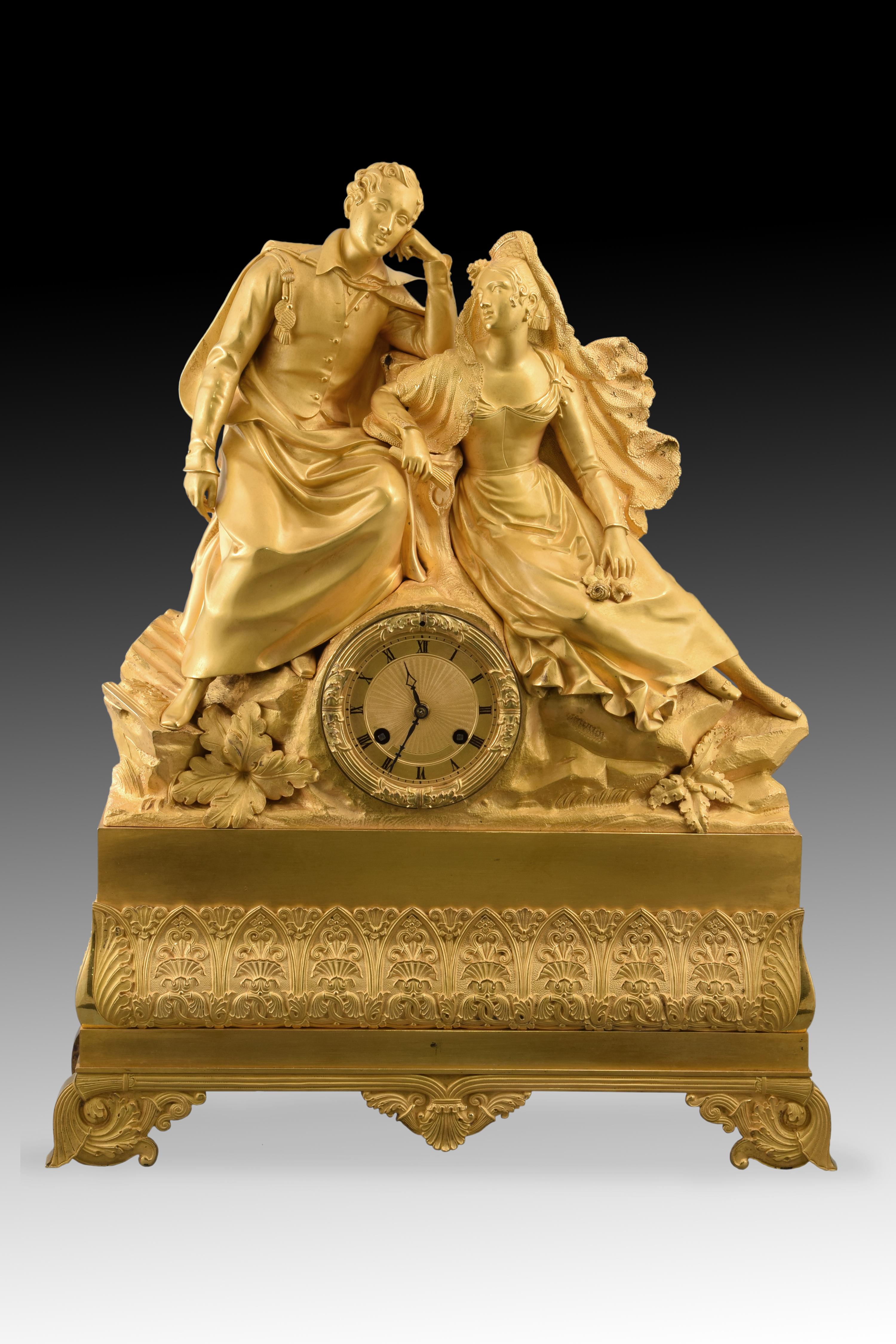 Table clock. Ormolu. XIX century.
 Machinery in working order.
 Table clock with box made of gilt bronze, and Paris machinery in working order. The base is raised on legs decorated with vegetal and architectural elements of clear classicist