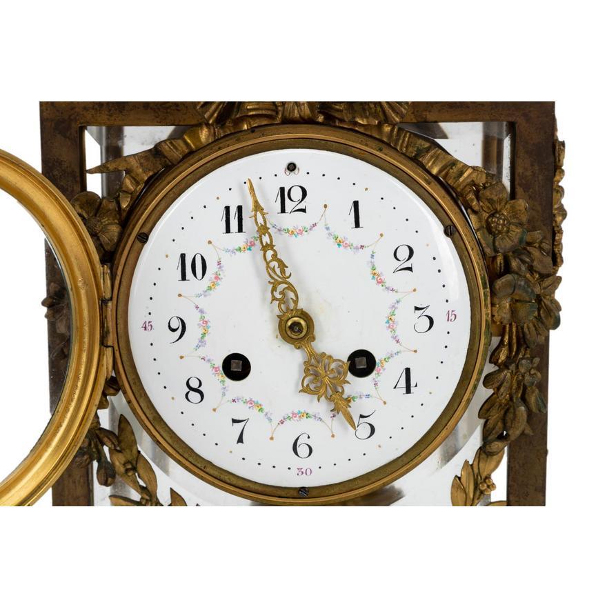 Vincent (or Vincenti) et Cie (French 19th century) gilt bronze  & Fluer de Pecher mounted marble mantle clock in the Louis XVI Neoclassical taste, circa 1900, the clock surmounted by a laurel wreath with a quiver and a torch, having an enamel face