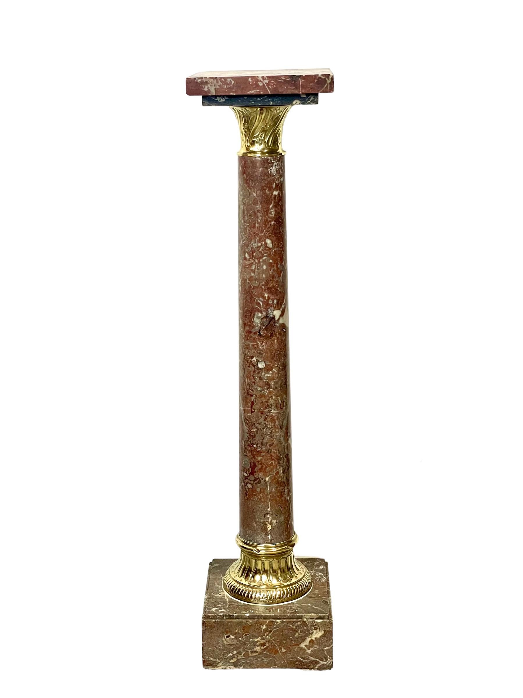 A spectacular gilt-bronze mounted pedestal, hand-carved from deep-red veined marble, and ideal for the display of a large and valued indoor plant or piece of sculpture. This decorative column features a square tray resting on a smaller, grey marble