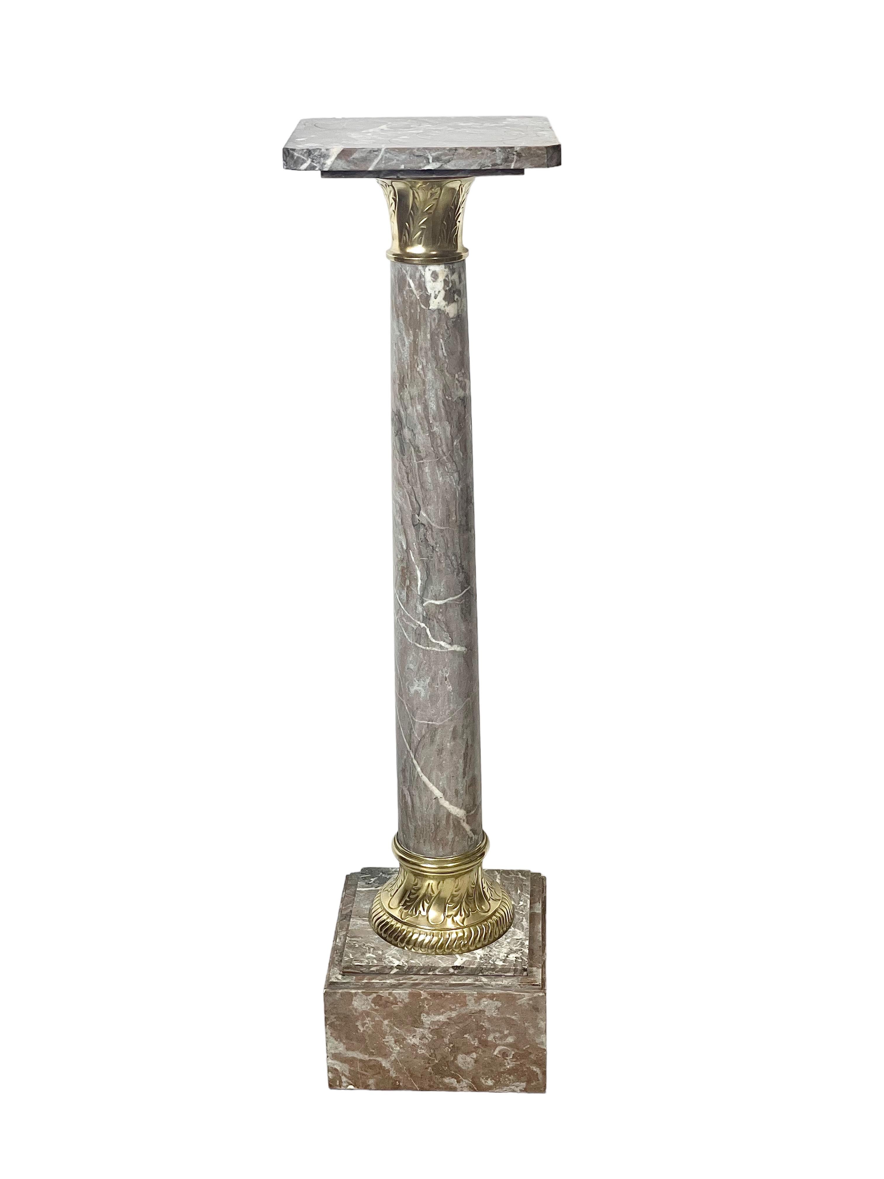 A wonderful gilt-bronze mounted pedestal, hand carved from beautiful grey-veined marble, and ideal for the display of a large and valued indoor plant or piece of sculpture. This decorative column features a square tray with chamfered corners resting