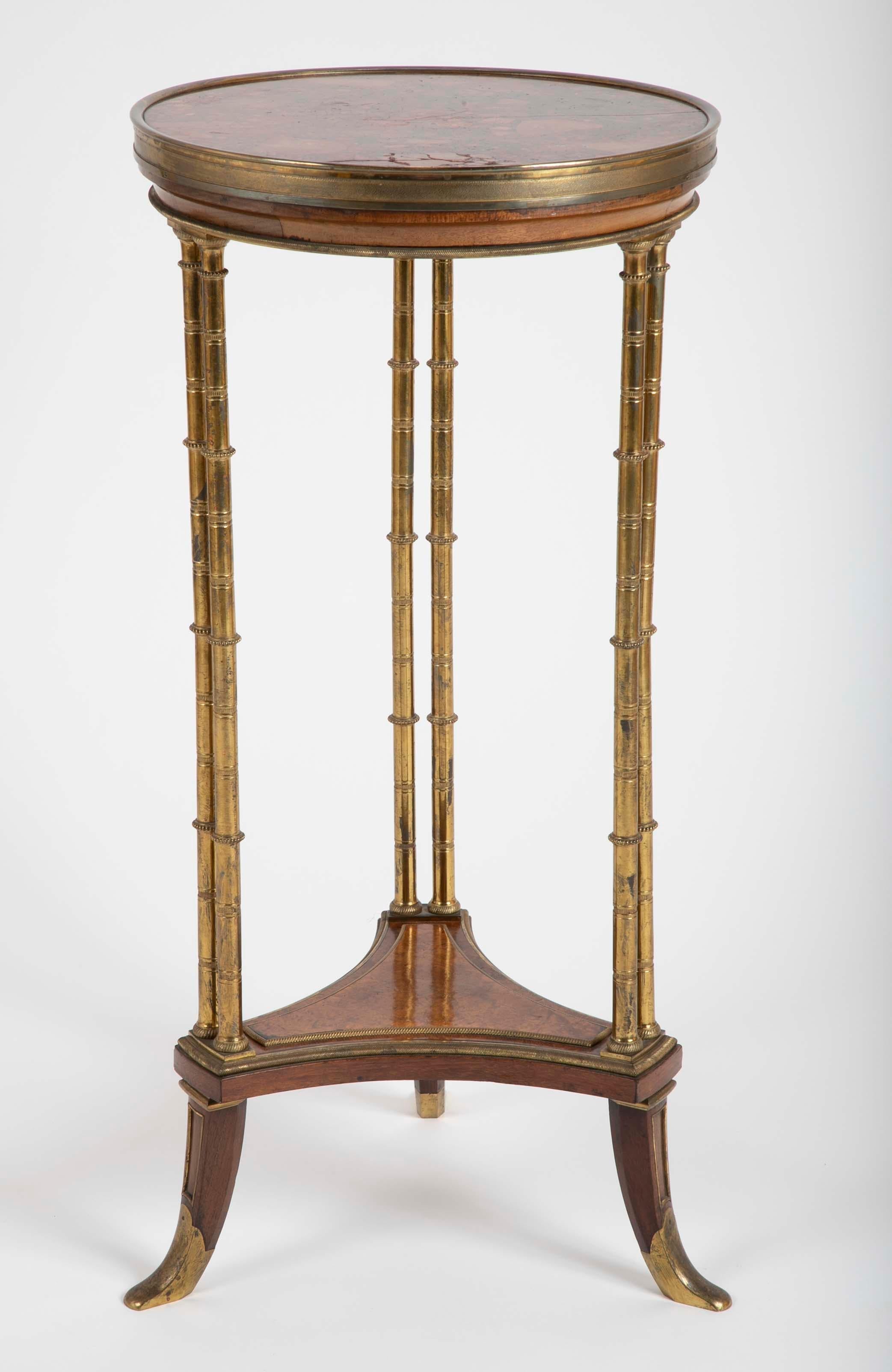 French gilt bronze mounted Amboyna burr and mahogany Louis XVI style guéridon after the model by Weisweiler (1750-1810) with Brocatelle marble top, circa 1880.
Similar example in many prestigious collections.
  