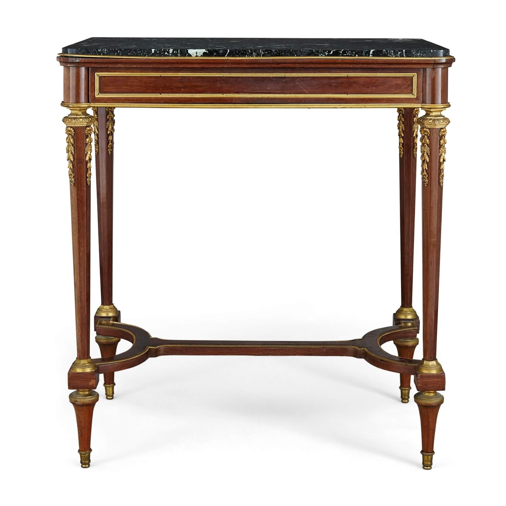 Gilt bronze mounted Neoclassical style side table by Thiébaut Frères
French, 19th century
Measures: Height 75cm, width 68cm, depth 45cm

This charming side table is crafted from wood, gilt bronze, and marble. The table features a rectangular