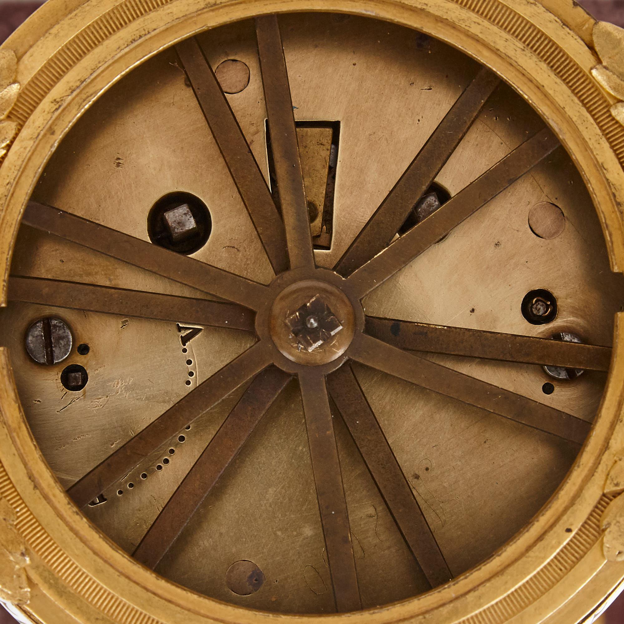 French Gilt Bronze Mounted Porphyry Revolving Dial Mantel Clock For Sale