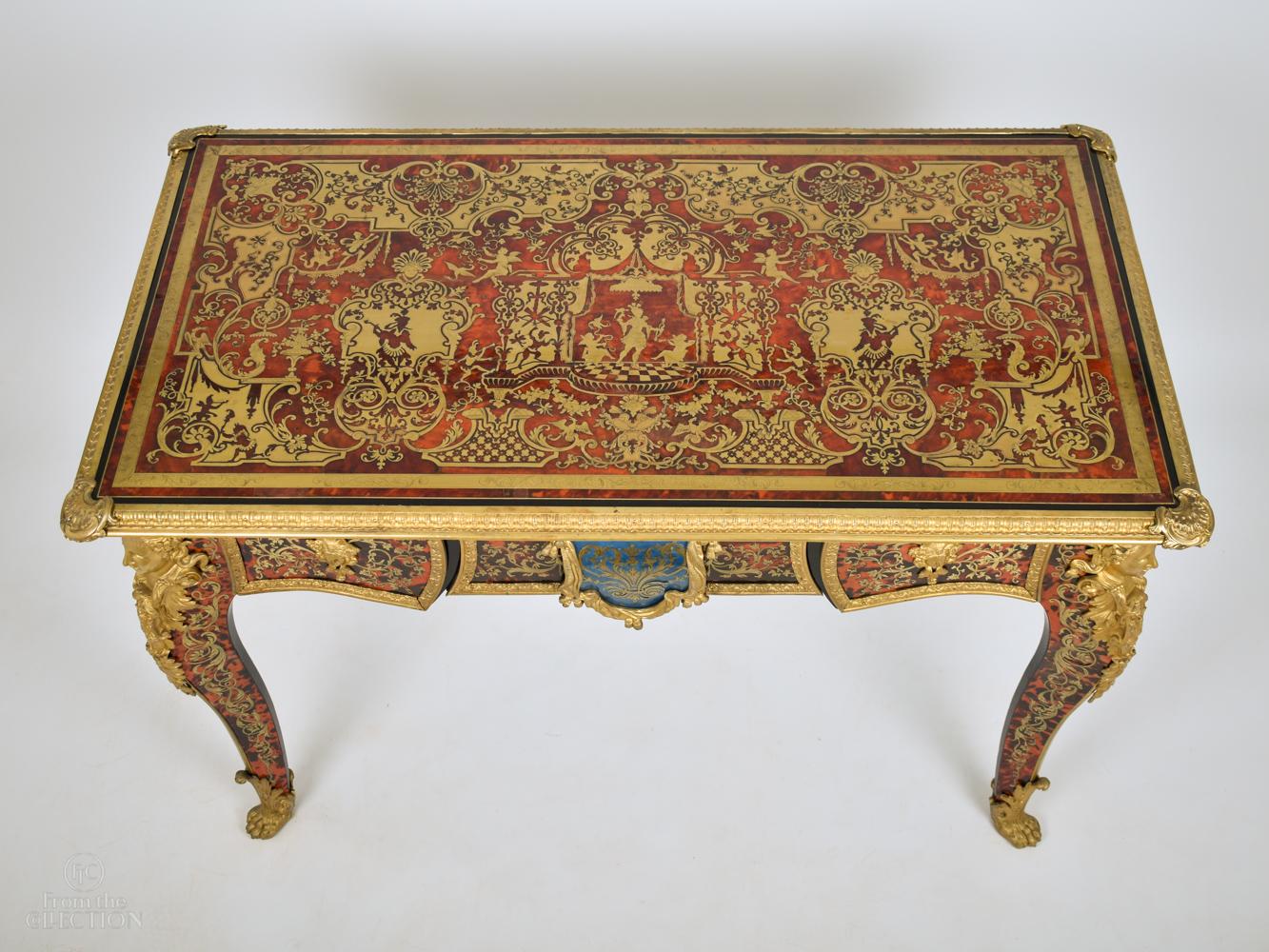 Gilt bronze mounted tortoise shell and brass inlaid Boulle centre table. Late 19th Century early 20th century. Exquisitely detailed Jean-Jacques Boulle centre table with gilt bronze mounts and edging three drawers to the front and blank or dummy