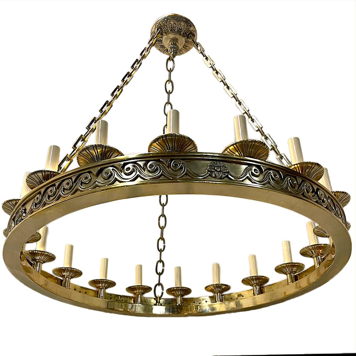 A French, circa 1920 neoclassic-style 18 light chandelier with waves and rosettes details.

Measurements:
Diameter: 32
