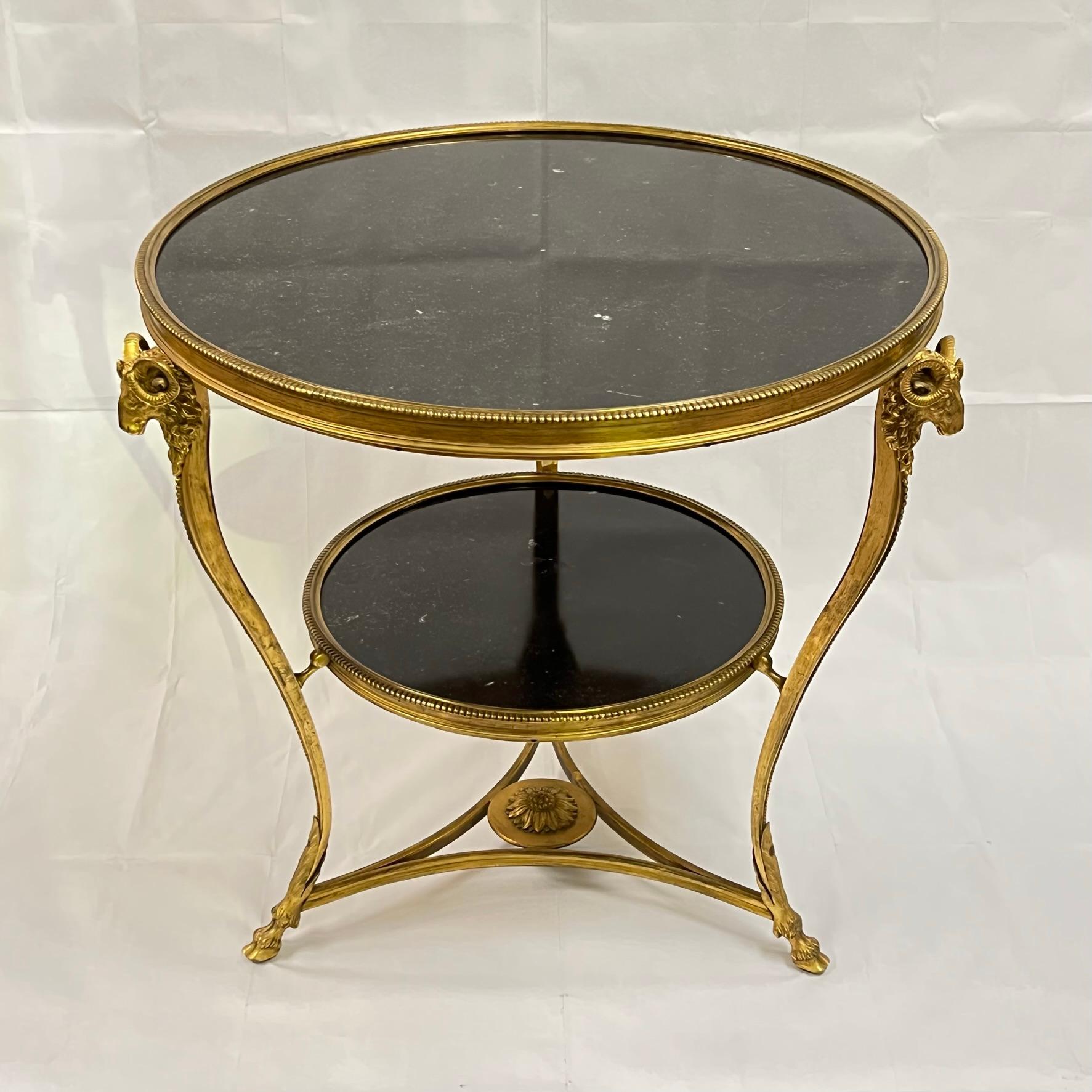 Neoclassical center or side table with charcoal marble top and exceptional gilt bronze mounts.