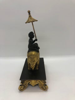 Gilt Bronze of Boy with Umbrella on Elephant