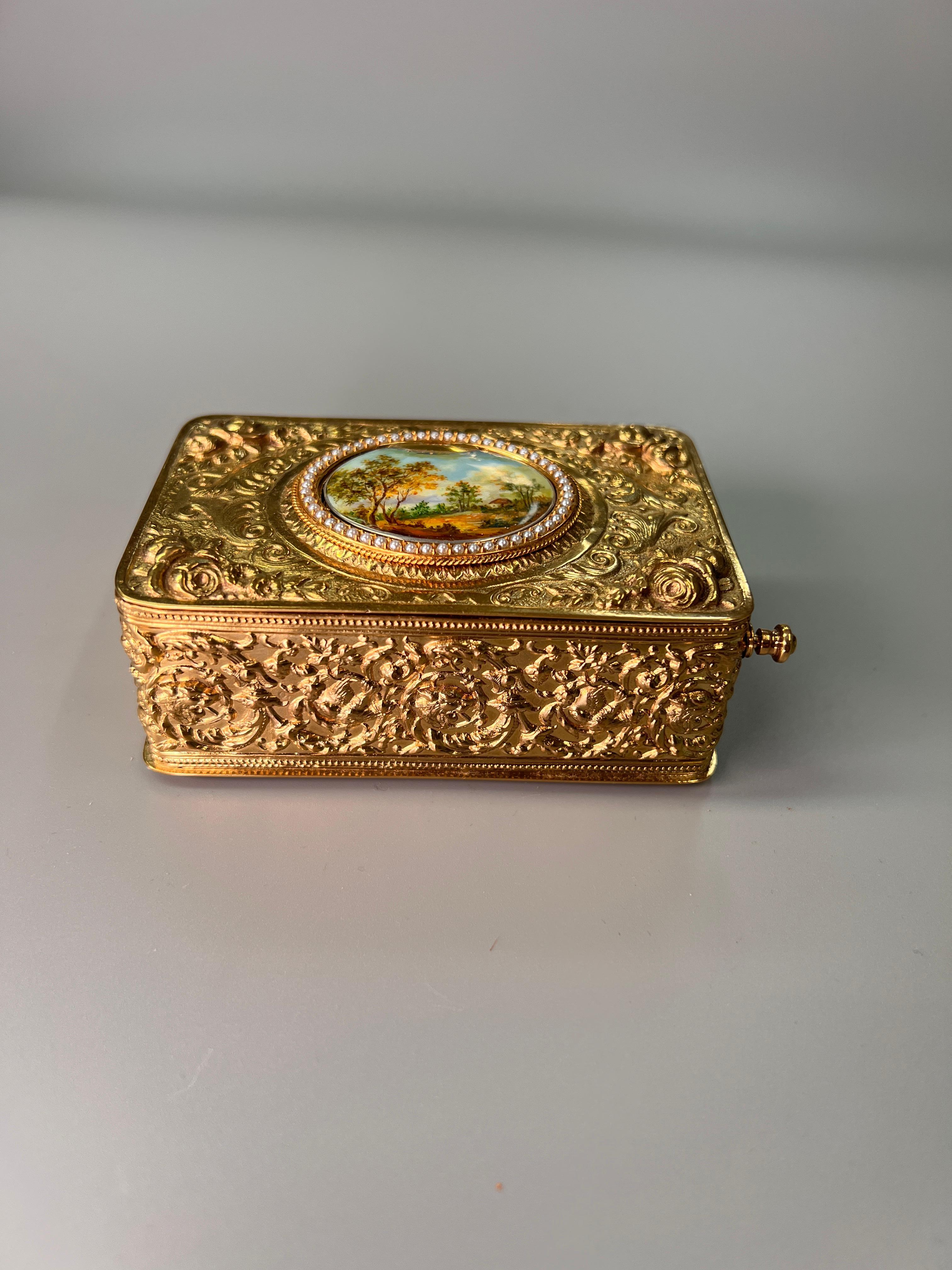 A stunning gilt bronze and seed pearl singing bird box by Bontems of Paris - CIRCA 1890.
The bird rises from beneath the enamal oval lid and is sure to delight! 

