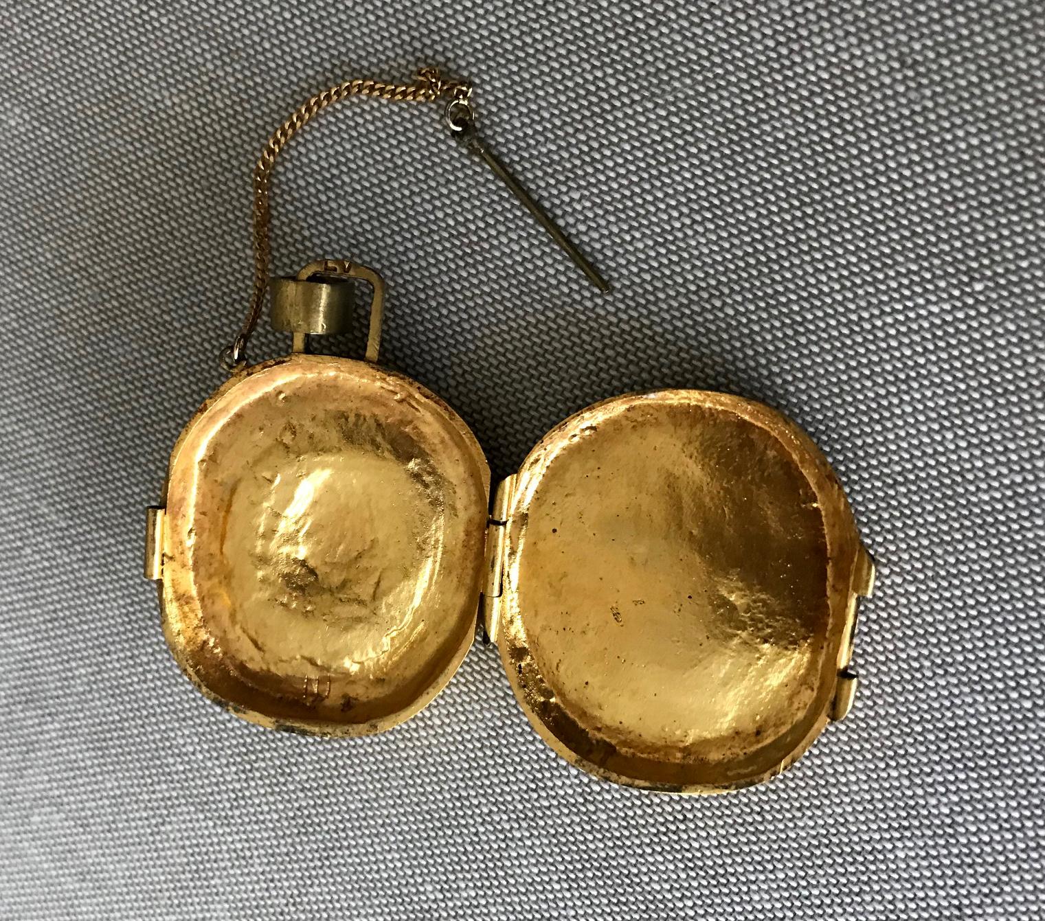 A piece of wonderful jewelry by Line Vautrin designed in 1941 on the subject of St Foi, a child martyr on the early fourth century and the patron saint of prinsoers, in a rare form of a reliquary pendant with a lock pin attached to a chain. The