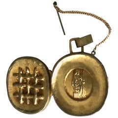 Pendentif reliquaire en bronze doré de Line Vautrin