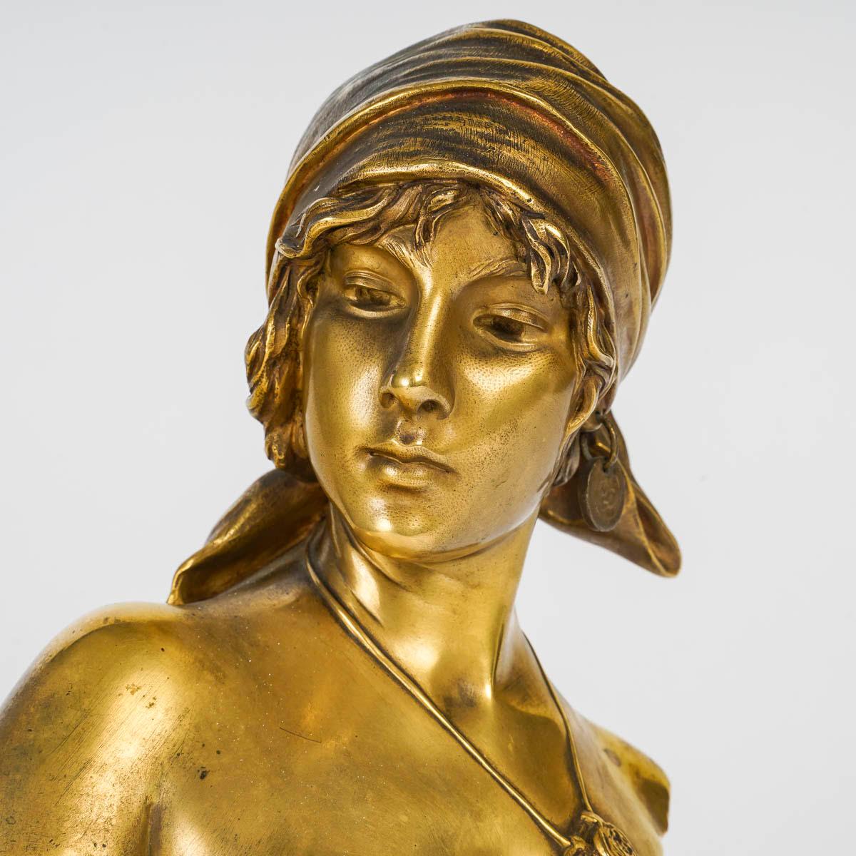 Gilt bronze sculpture by Emmanuel Villanis, Early 20th Century.

An Art Nouveau period sculpture, circa 1900 by Emmanuel Villanis, representing a bust of a young woman, the Bohemian, in gilded bronze.
h: 28cm, w: 17cm, d: 12cm