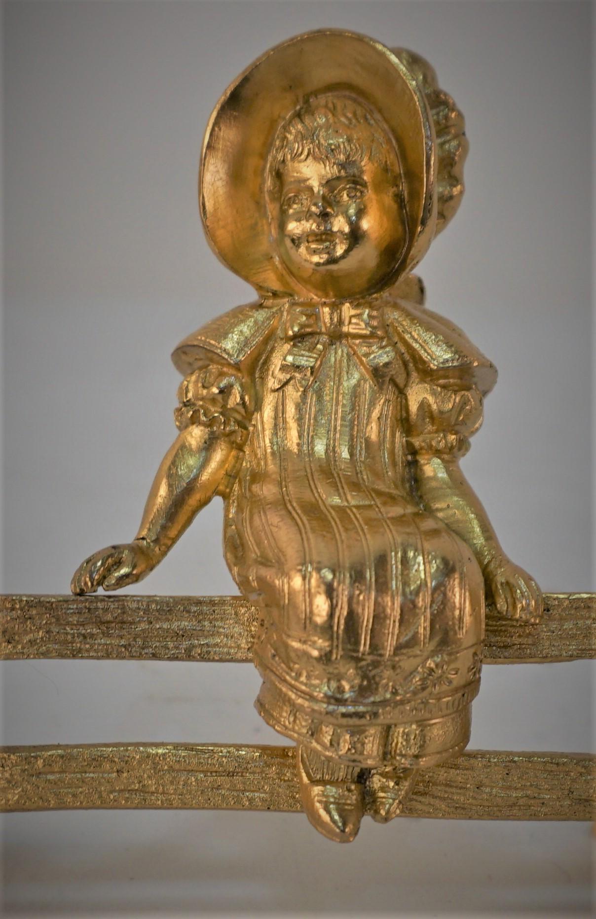 Early 20th Century Gilt Bronze Sculpture, Little Girl Setting on Wooden Fence For Sale