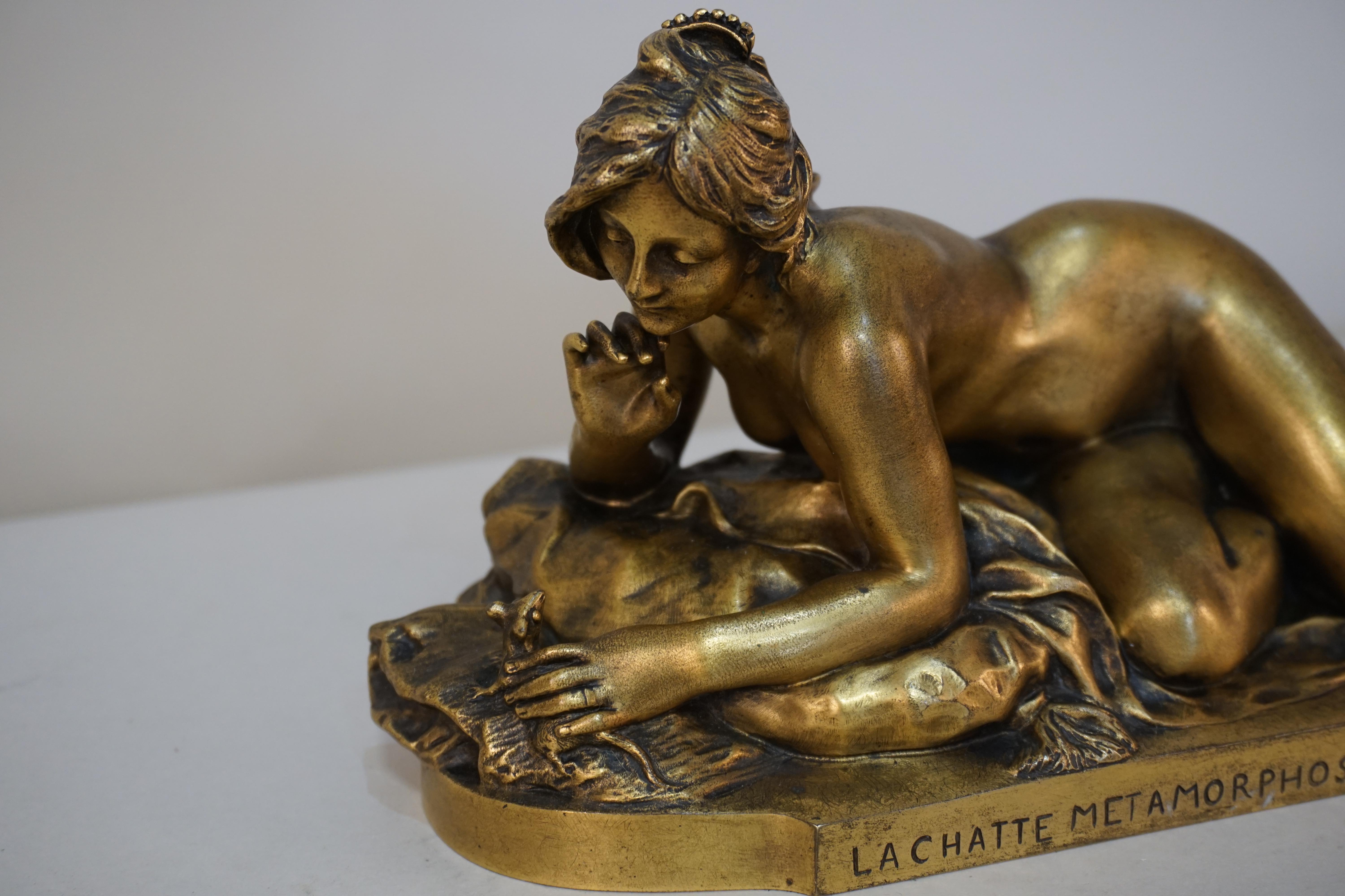 Gilt bronze sculpture of a nude female with mouse. Front with the inscription 'LA CHATTE METAMORPHOSEE EN FEMME' by Ferdinand Faivre
and casting by Thiebaut Freres.