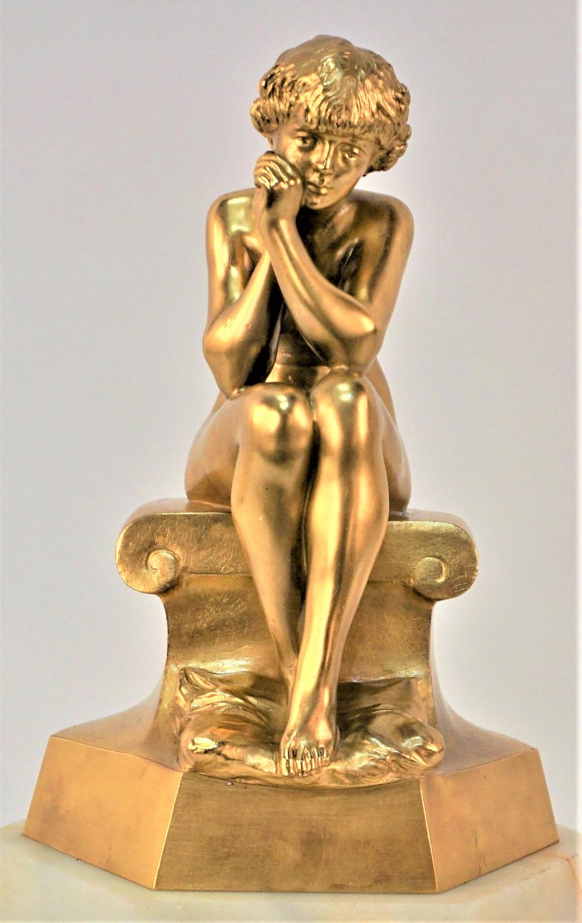 Gilt bronze Sculpture Young man in sitting position over onyx base title (Meditation) by Florentin Louis Chauvet (1878-1958).