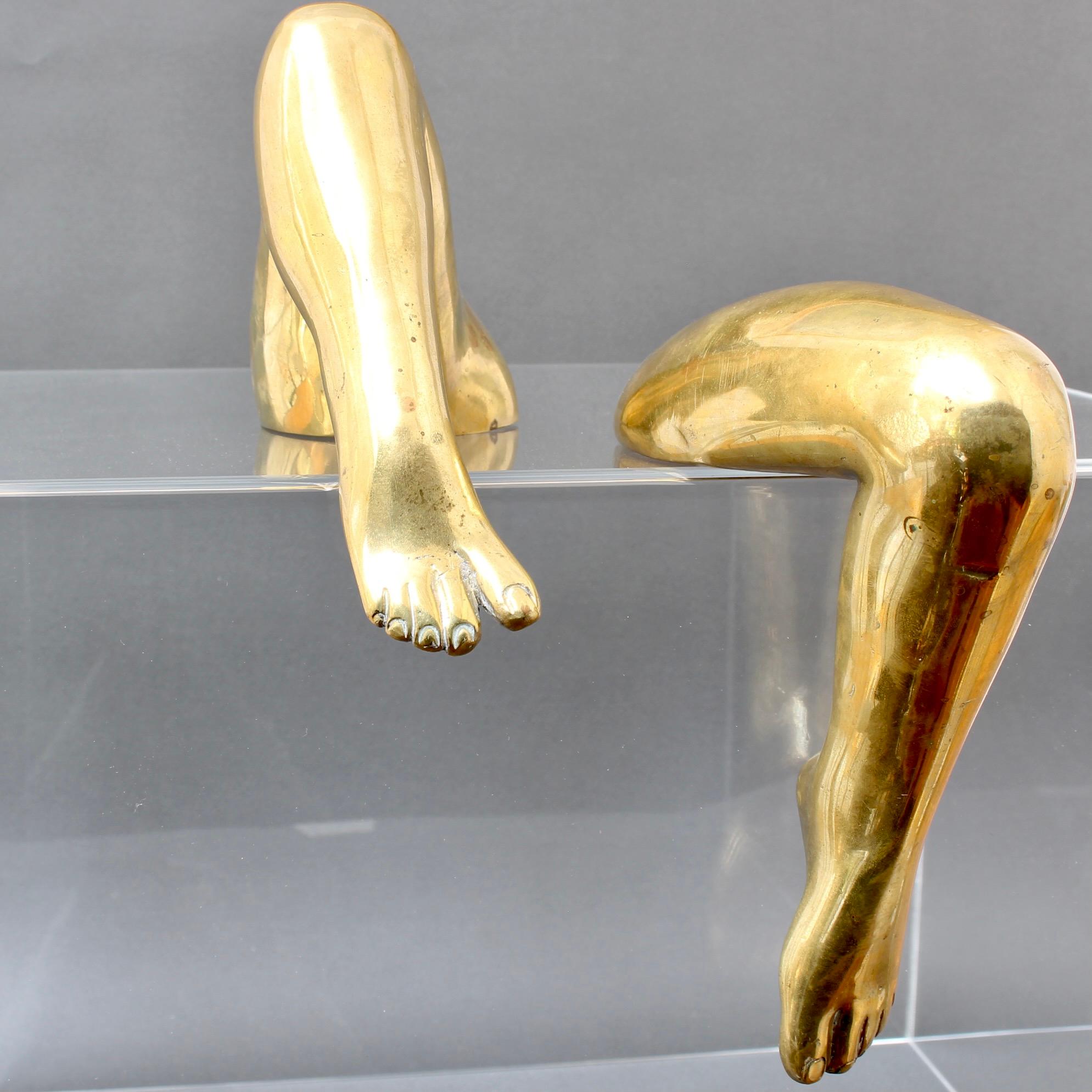 Gilt bronze legs by award winning artist Pietrina Checcacci (circa 1970s). Although her art comes in many forms, these distinctive pieces come from a period in the 1970s and 80s in which body parts in close-up: hands, fingers, legs, feet and noses