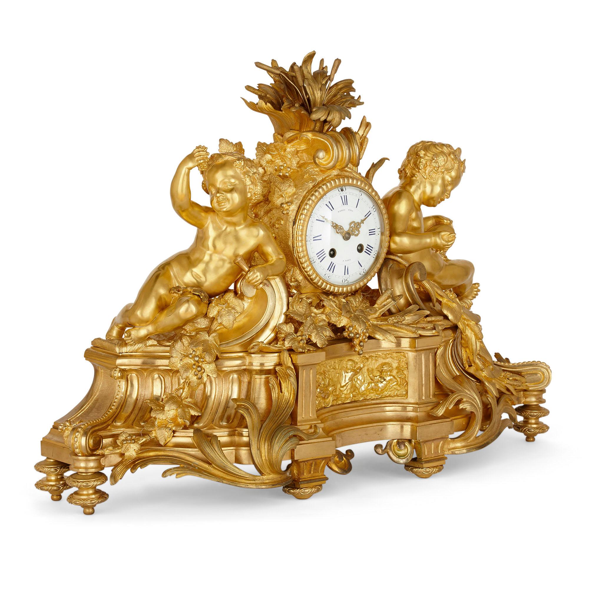 Gilt bronze three-piece clock set by Raingo Frères and Henri Picard

This exceptional 19th century clock set comprises of three pieces crafted from gilt bronze: a central mantel clock flanked by a pair of candelabra in the Rococo style.
 
The